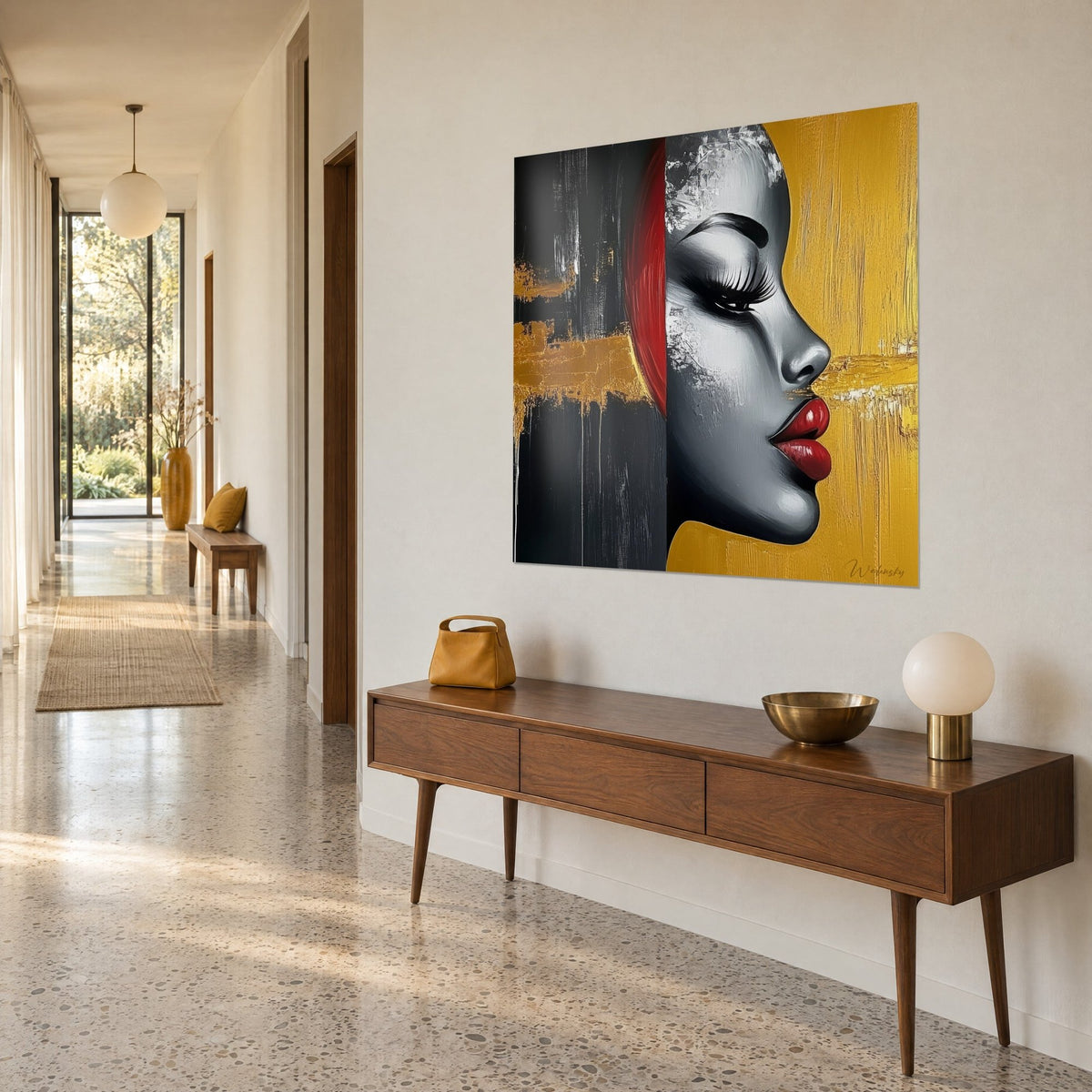 Wall art silver-grey woman's face, red strand and black and gold stripes, hung in a bright hallway, three-quarter view
