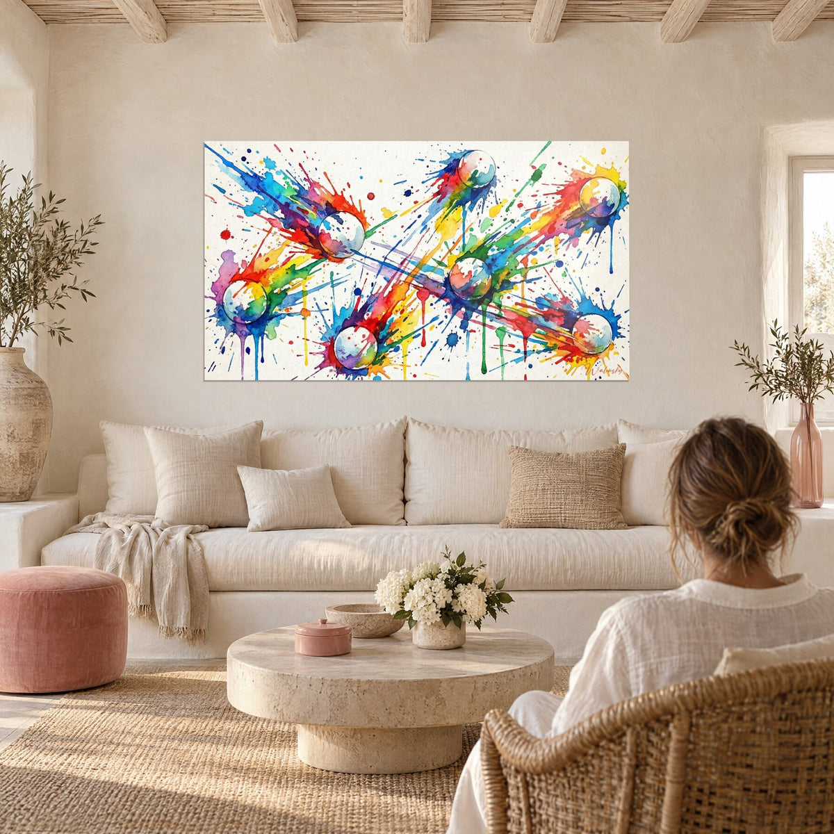 Wall art of ping-pong balls launched into blue and red splashes, above a sofa in a bright living room