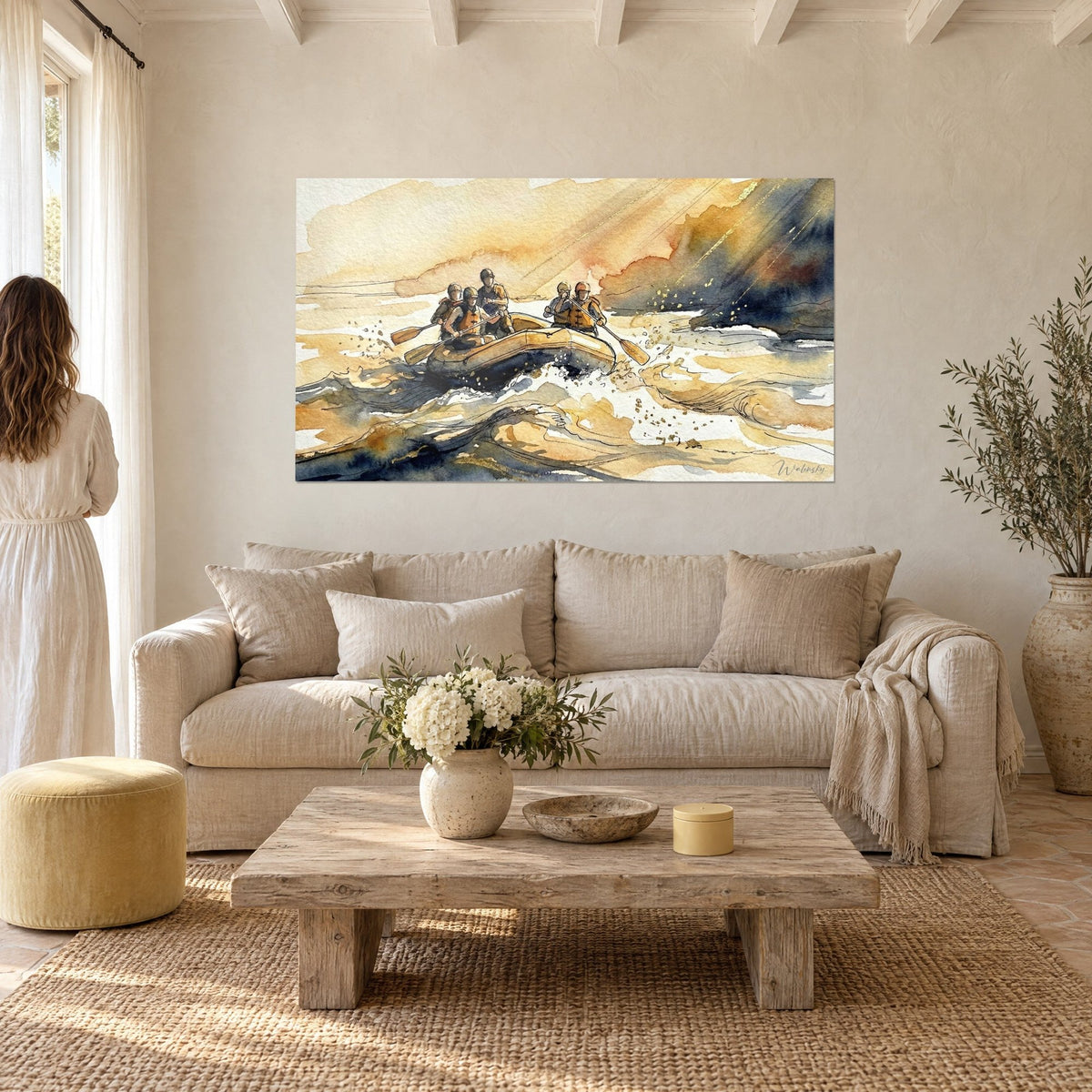 Wall art yellow raft tossed by golden and midnight-blue rapids, helmeted rowers, a woman seen from behind, above a sofa in a bright living room