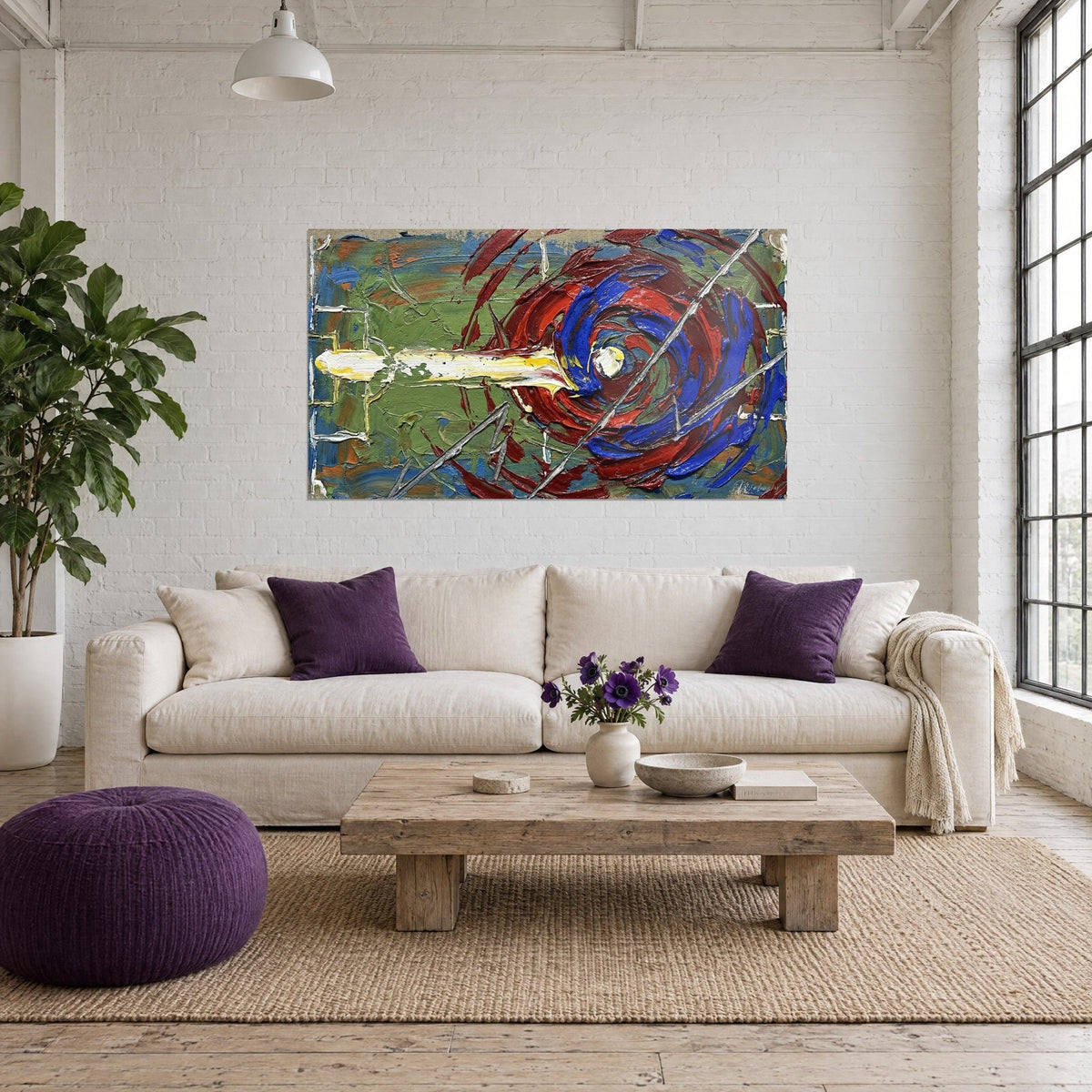 Tableau spirale rouge et bleu cobalt sur fond vert olive, traînée blanche épaisse, au-dessus d'un canapé dans un salon lumineux