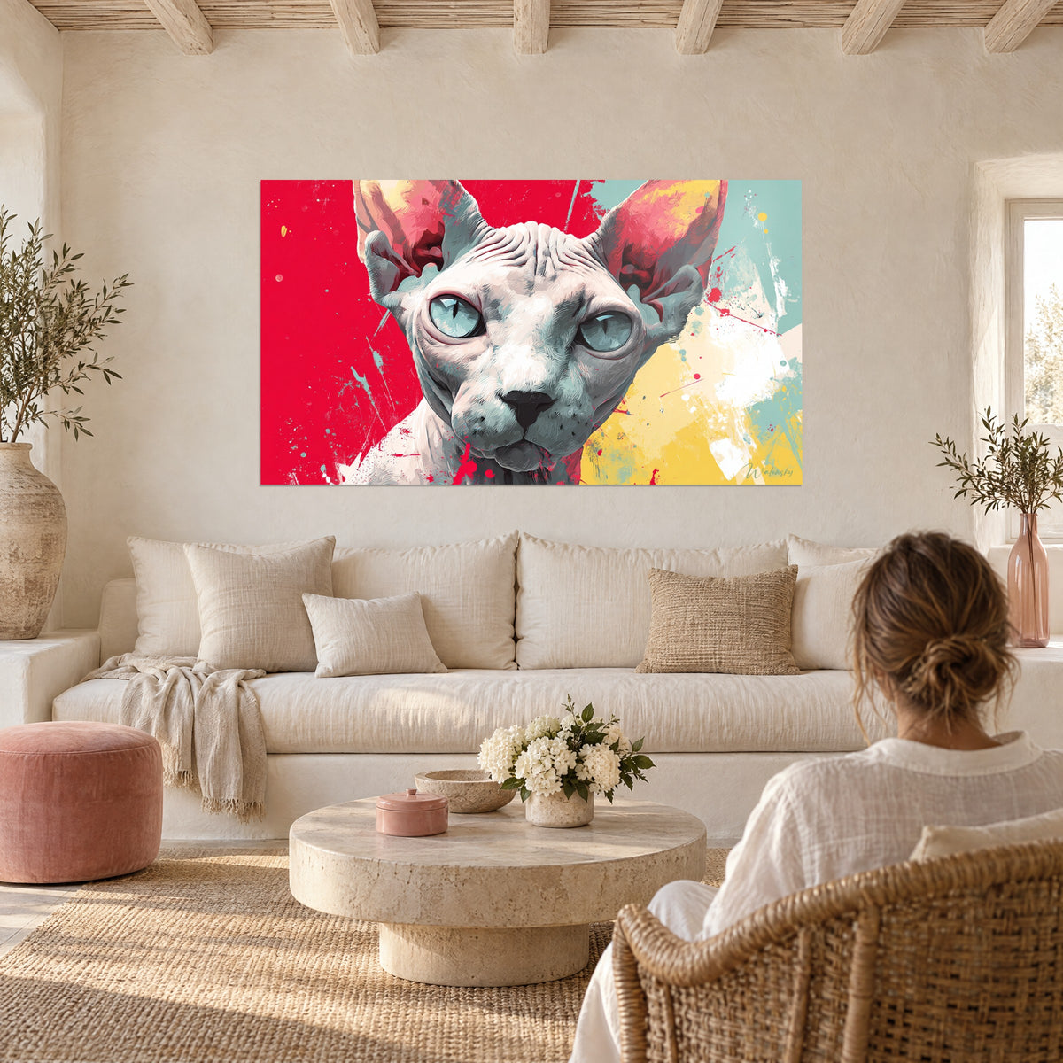 Wall art Sphynx cat with glacier-blue eyes, pink ears on a bright red and yellow background, above a sofa in a sunlit living room