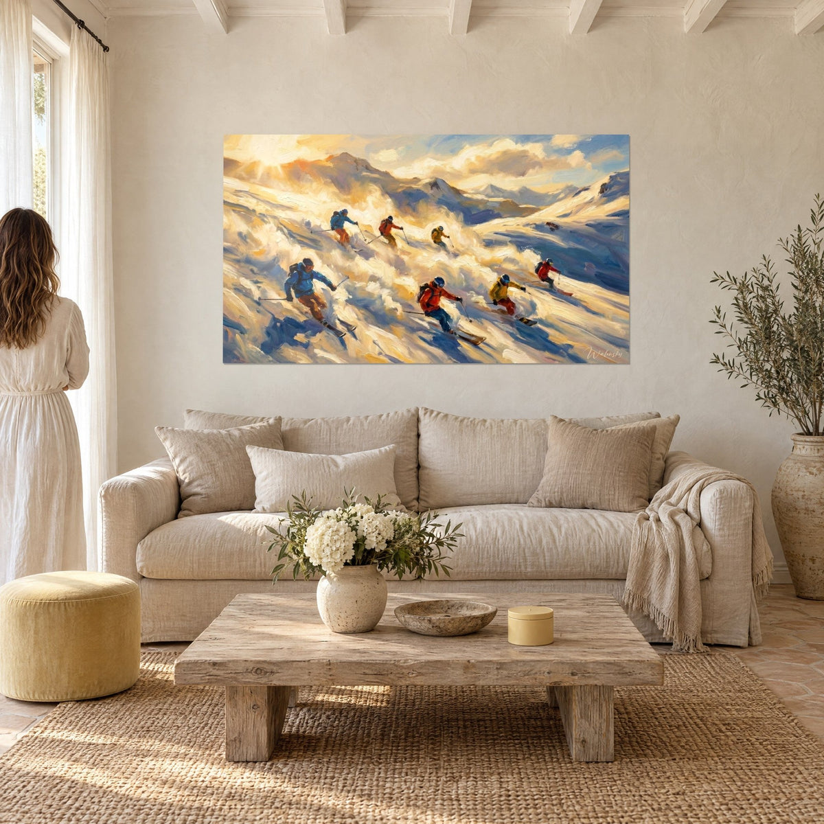 Wall art of six skiers racing through golden powder snow, blue and red jackets, ochre ridges, above a sofa in a bright living room