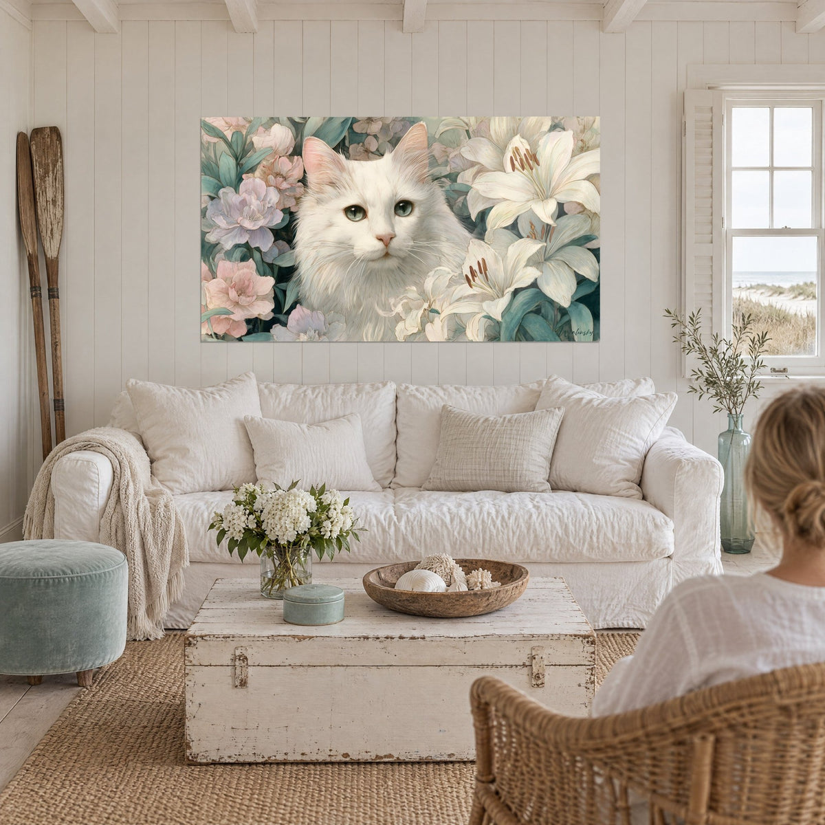 Wall art white Angora cat with grey-green eyes among ivory lilies and pink peonies, above a sofa in a bright living room