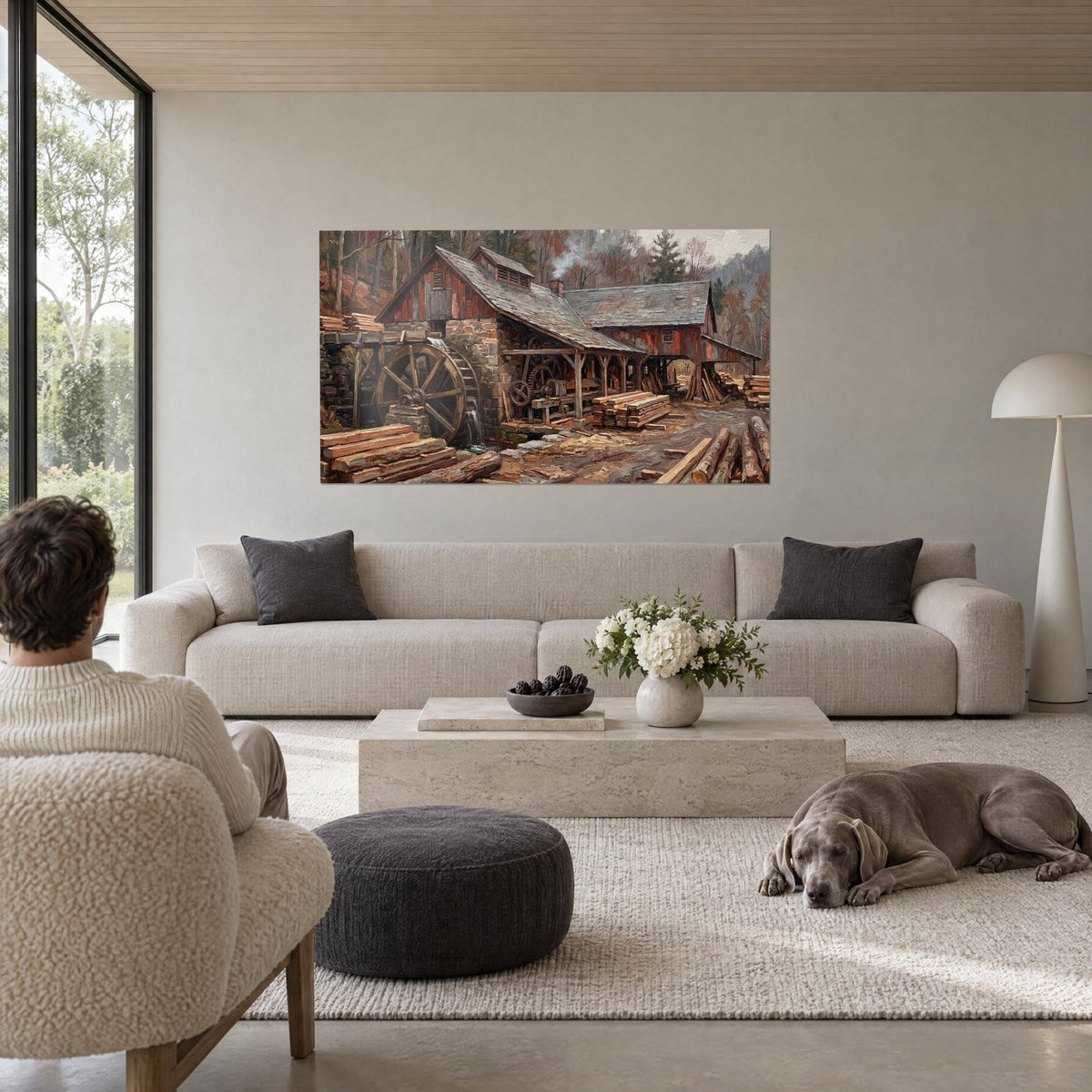 Wall art water mill in wood and stone, brown waterwheel, stacked ochre planks, man seen from behind and a dog, above a sofa in a bright living room