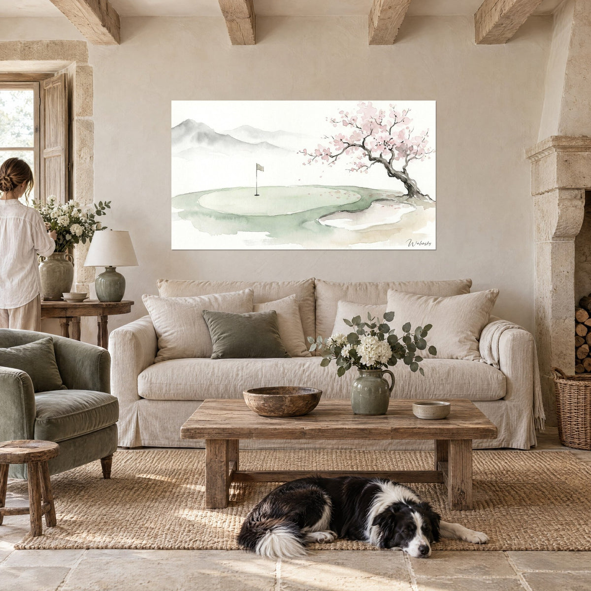 Wall art watercolor golf green, gray flag and pink blossoming cherry tree, a woman and a collie, above a sofa in a bright living room