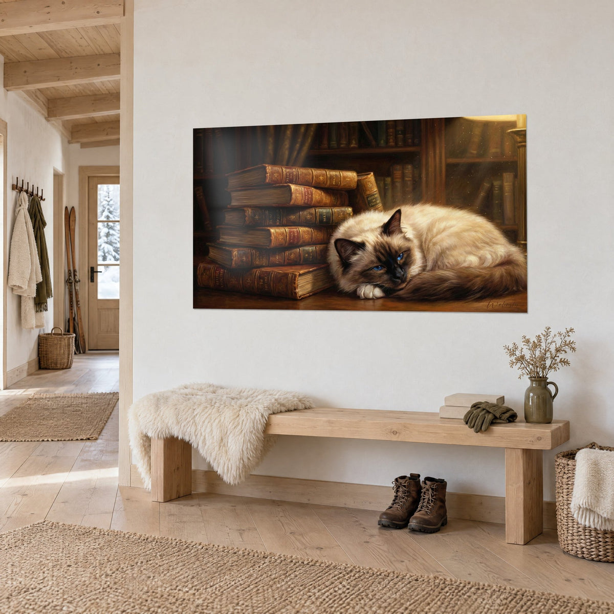 Tableau félin birman assoupi près d'une pile de grimoires cuivrés, lueur ambrée de lampe, mur clair d'un chalet en vue de trois-quarts