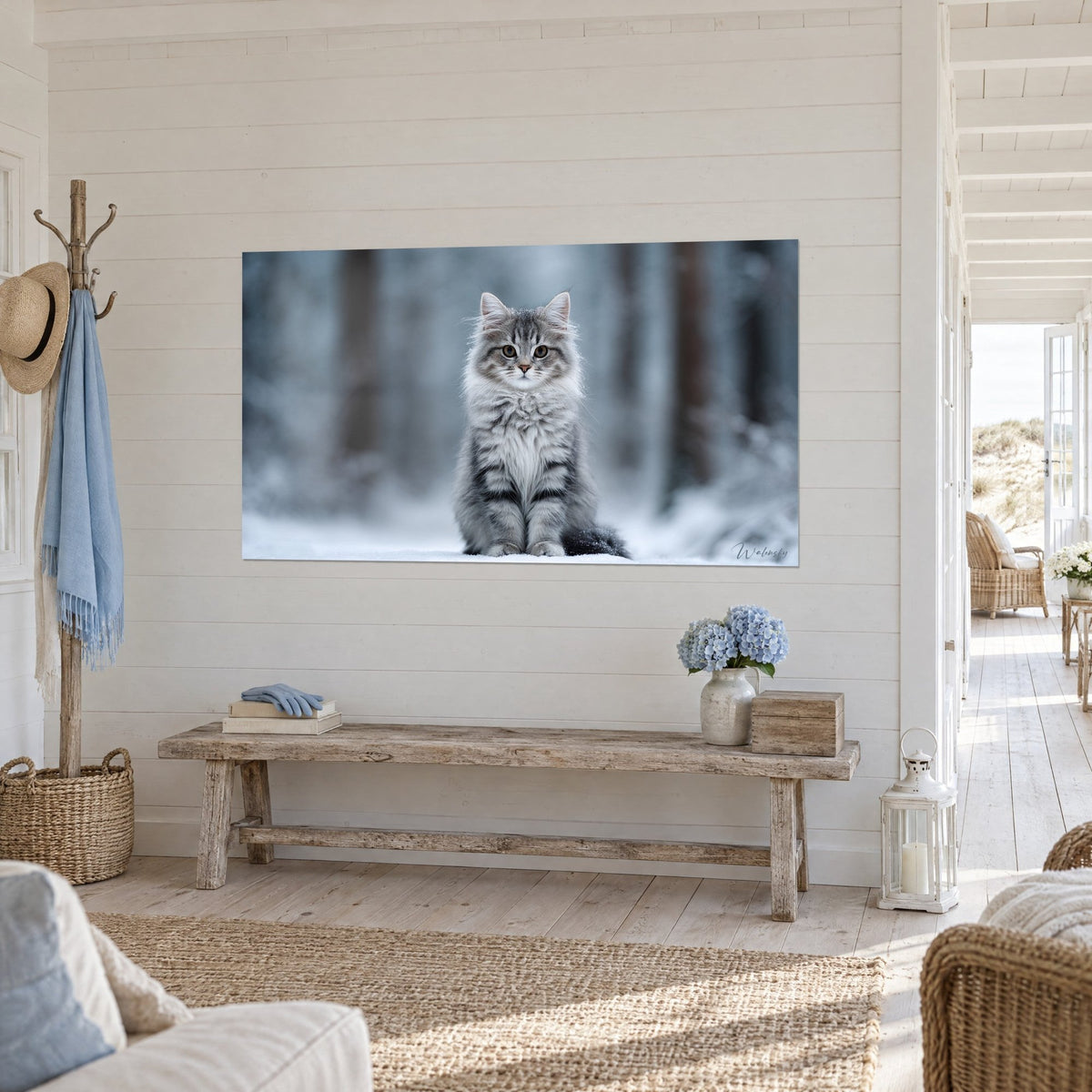 Wall art of a silver cat with black striped coat, pink muzzle and fluffy chest, frosty blue-grey background, displayed in a light entryway
