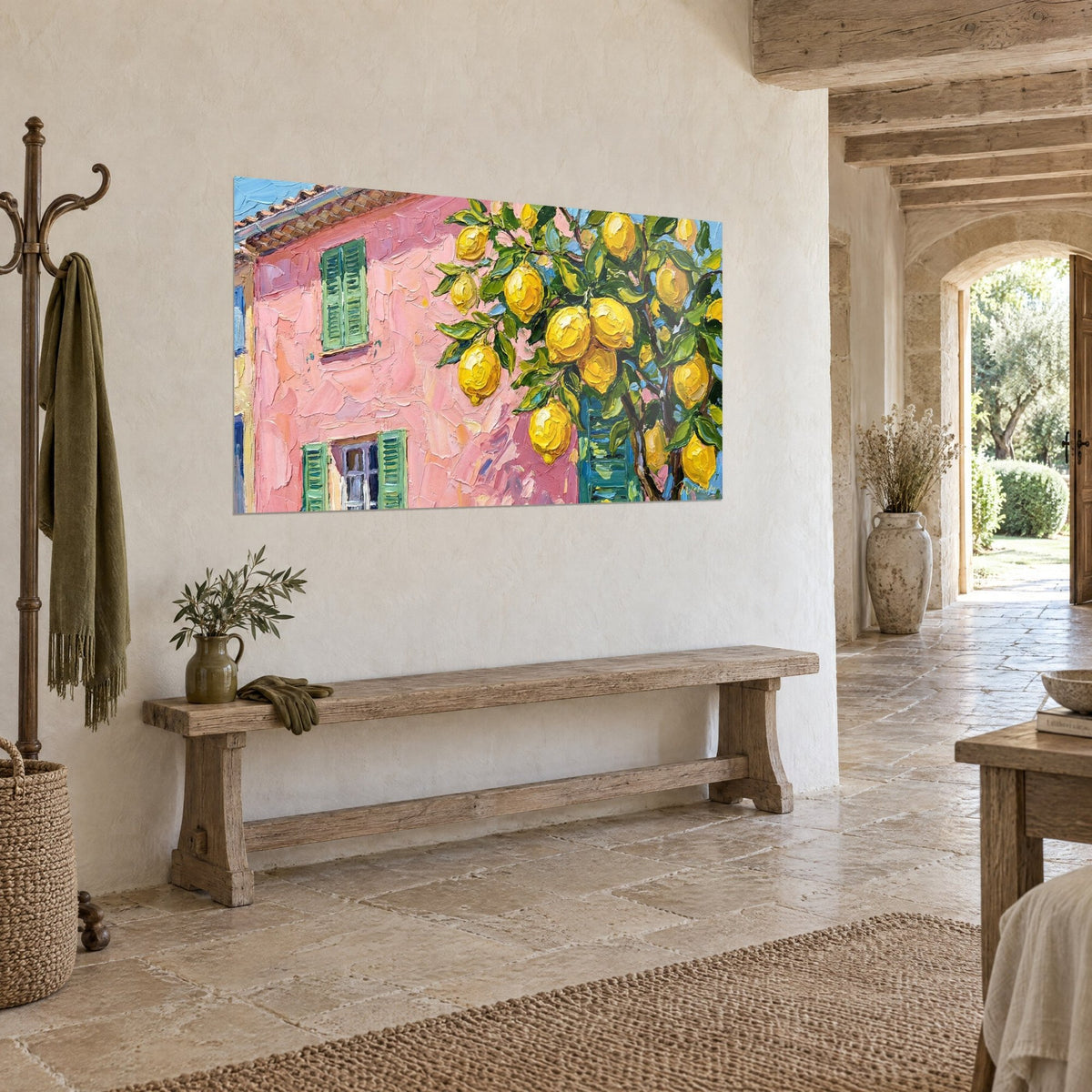 Wall art lemon tree laden with golden fruit in front of a coral pink wall, three-quarter view on a white stone wall