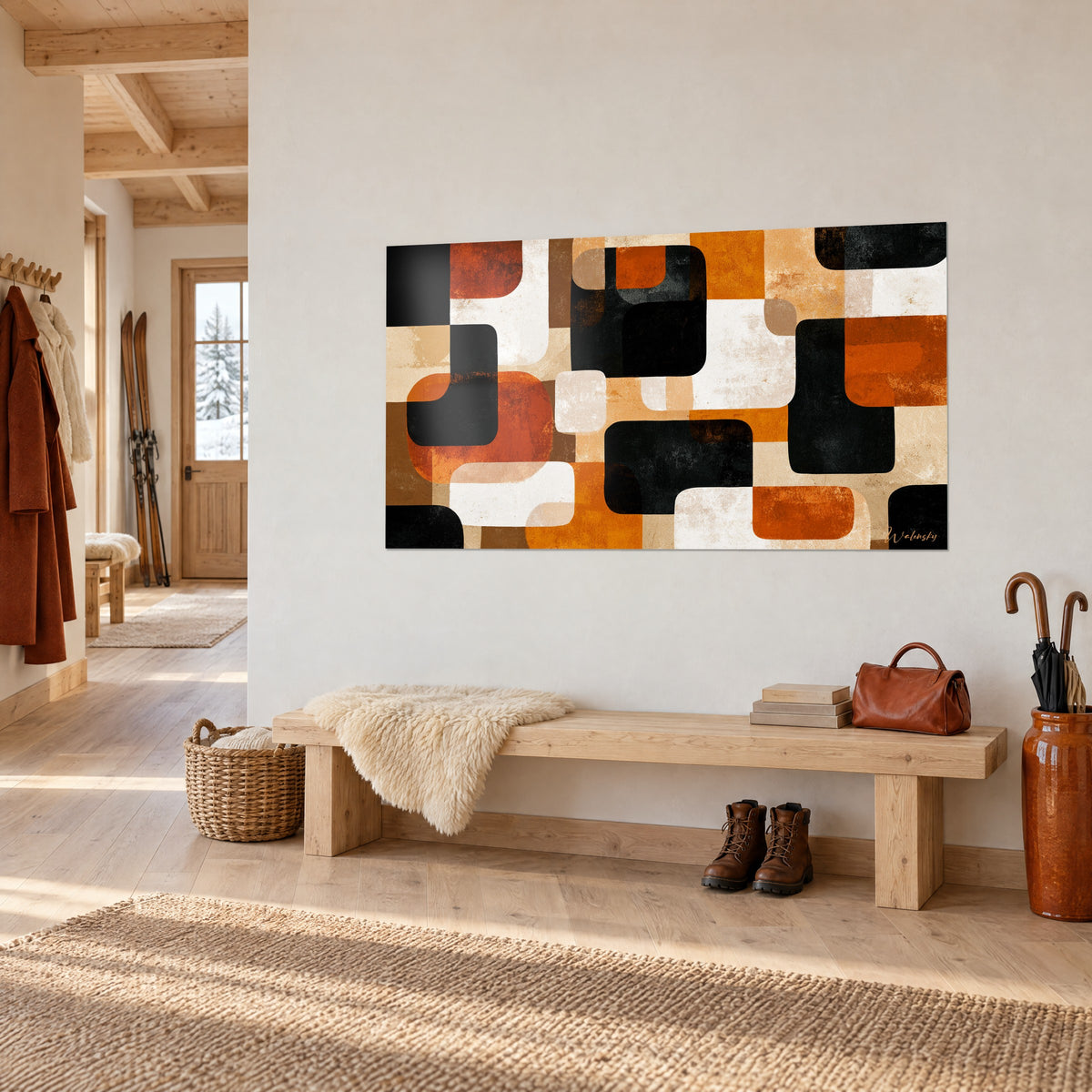 Tableau patchwork de blocs géométriques noir charbon, terracotta et ivoire sur un mur blanc, banc en bois clair, chalet