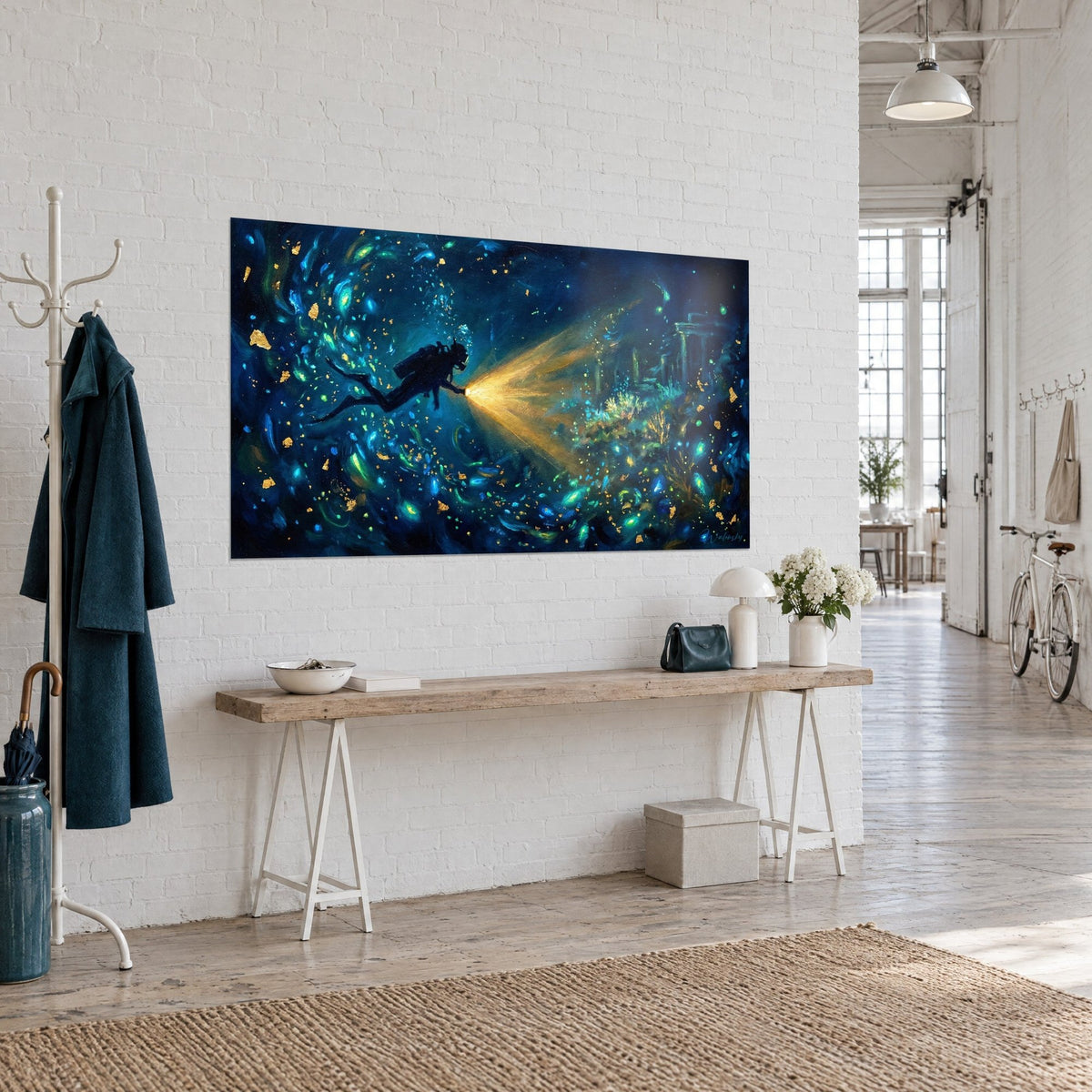 Wall art diver with amber light beam, golden sparks floating in deep blue, hung on a white wall, three-quarter view