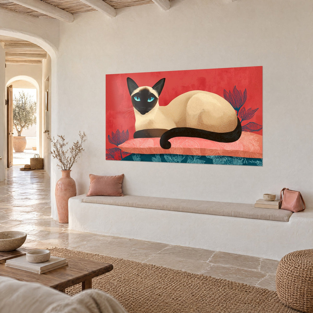 Wall art cream cat with a dark brown mask, black tail curled up, red and petrol blue backgrounds, three-quarter view on a white wall