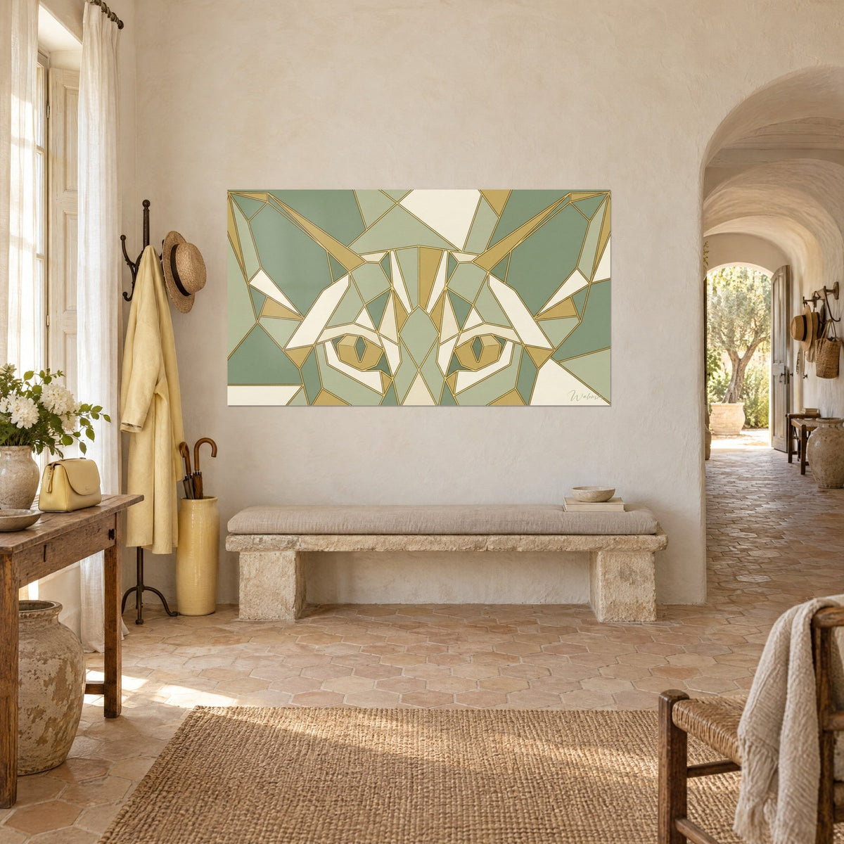 Wall art geometric cat with pointed ears, sage green and cream polygons outlined in gold lines, limewashed wall of a Provençal farmhouse