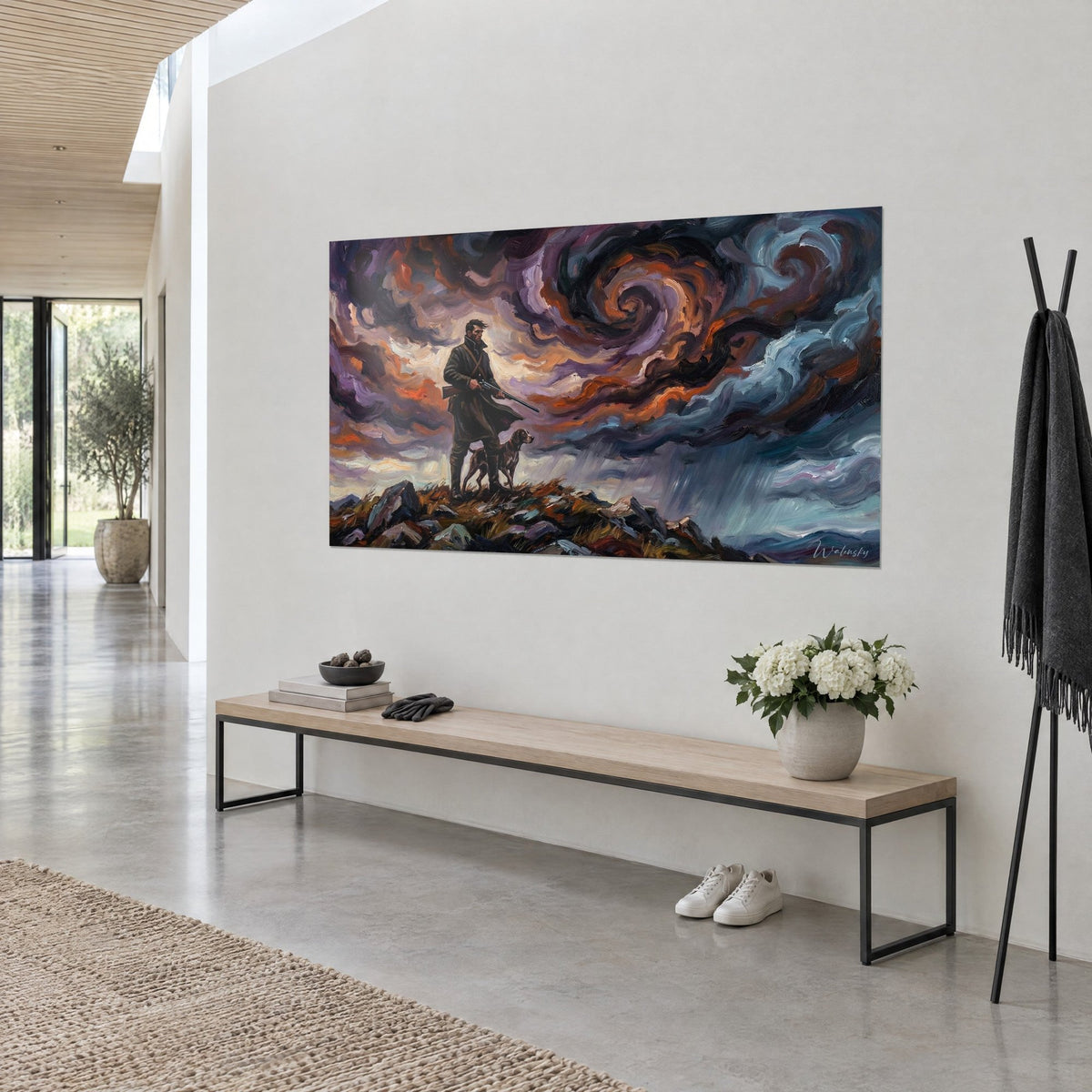 Quadro uomo con fucile su una cresta rocciosa, volute di nuvole cremisi e ramate, vista di tre quarti in un ingresso chiaro