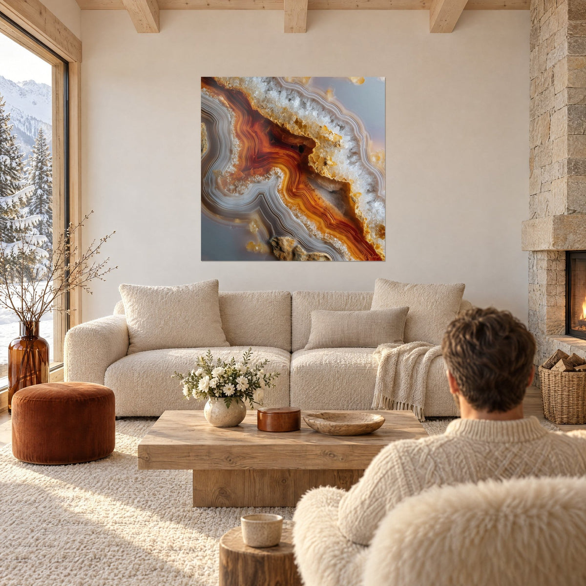 Wall art agate geode with orange and white veins, a man seen from behind, above a sofa in a bright living room