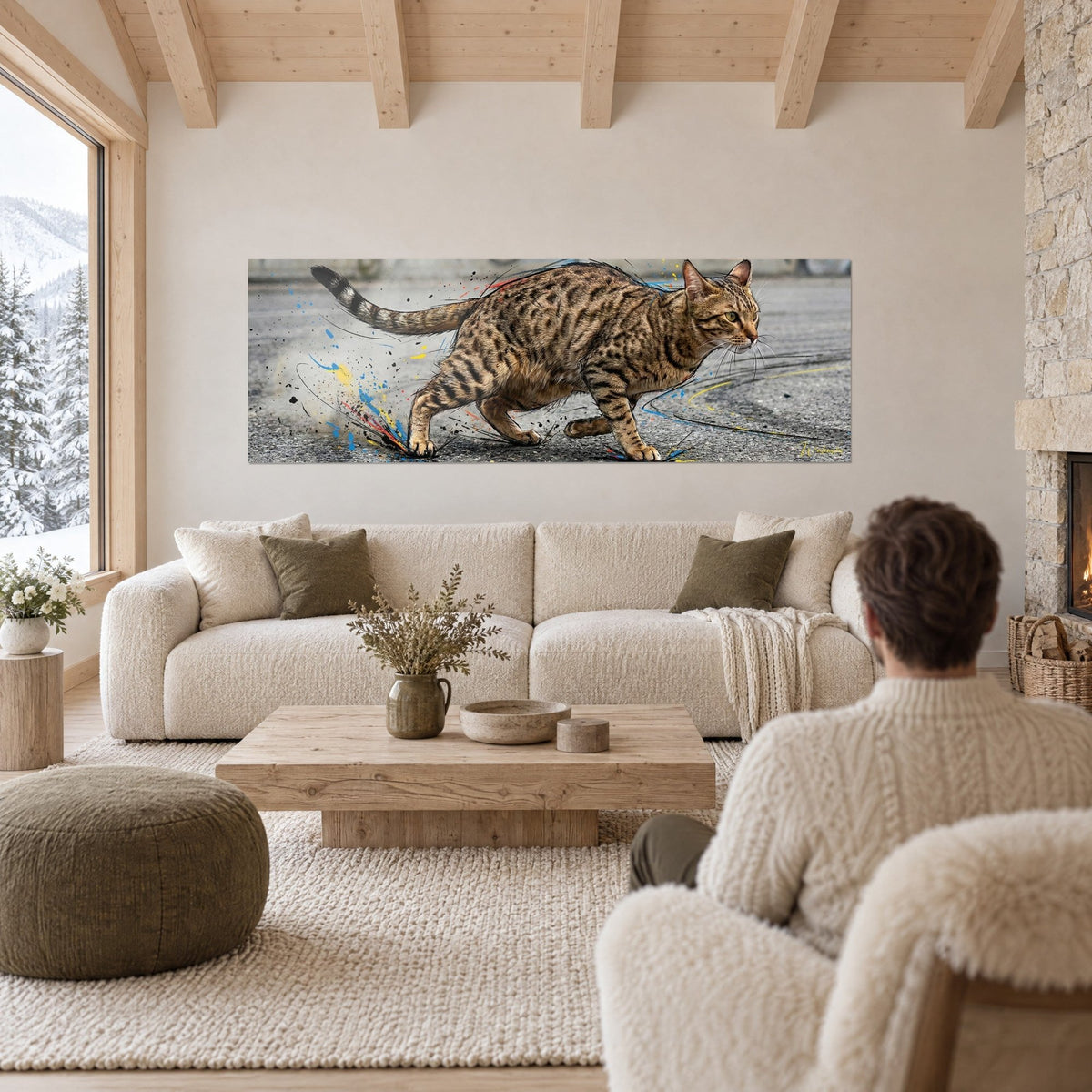 Wall art of a spotted cat in a supple stride, fawn and ochre coat, blue and yellow splashes, above a sofa in a bright living room