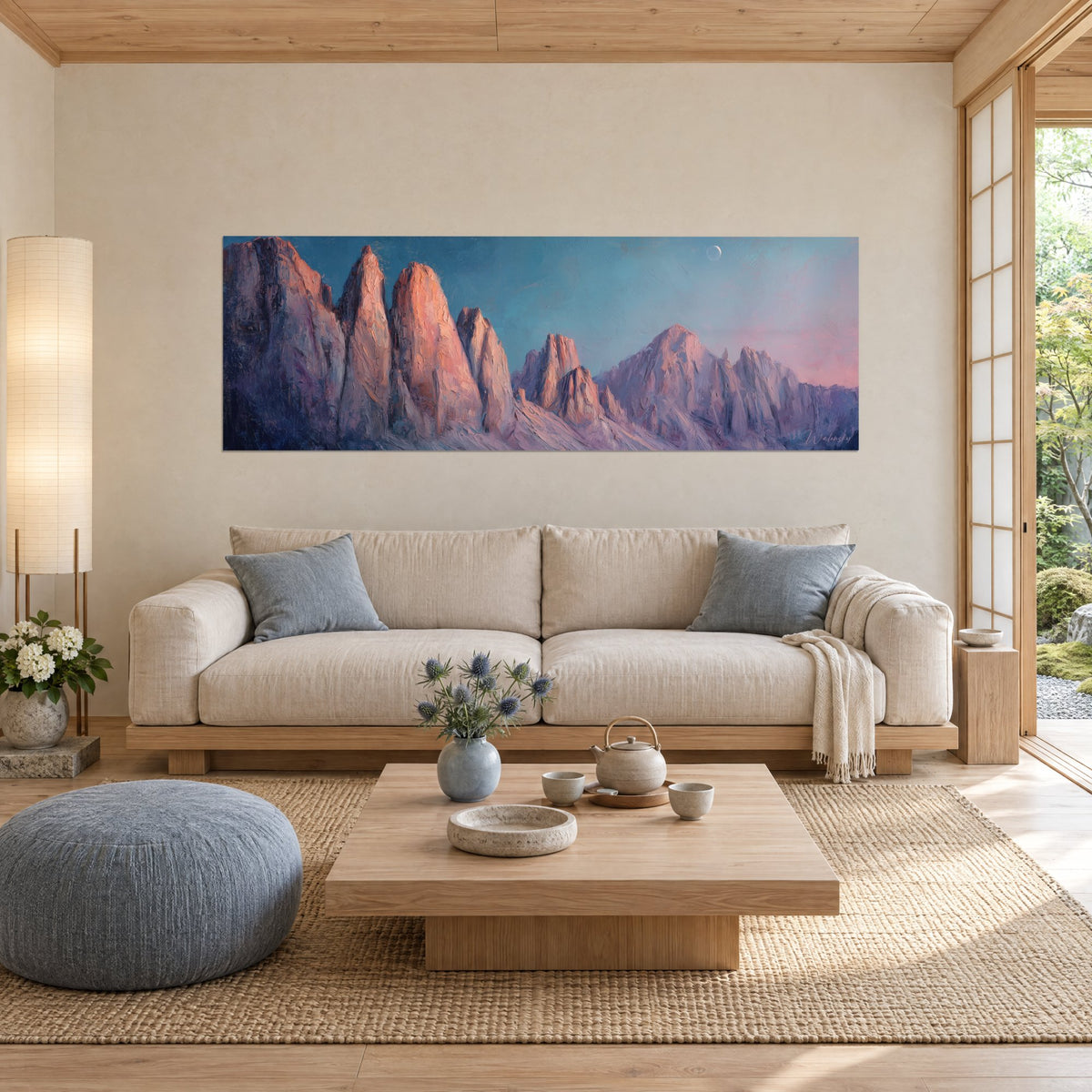 Wall art Dolomites in Alpenglow, pink rock spires and pale moon against a turquoise sky, above a sofa in a bright living room