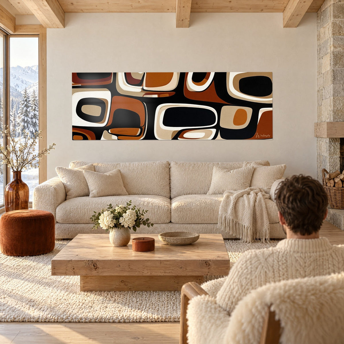 Wall art with rounded organic shapes in copper and black, outlined in ivory, above a sofa in a bright living room