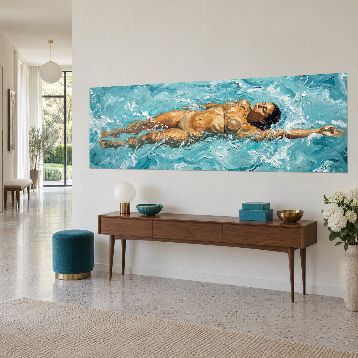 Wall art of a reclining bather, arm outstretched, black hair floating in turquoise and white waves, on a walnut console