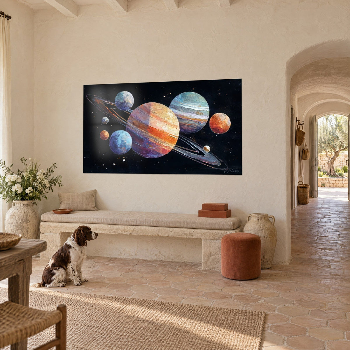 Wall art planets with silver rings, bluish globe and coral sphere against a starry night, facing a spaniel sitting on the tiles