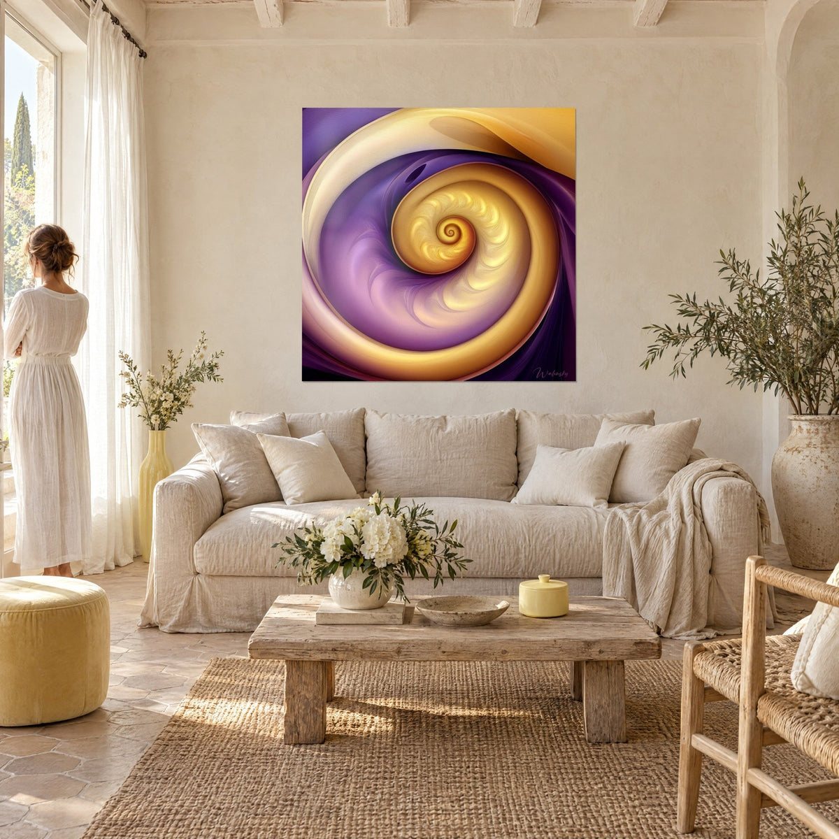 Wall art with a golden spiral on purple-crimson background, woman seen from behind, above a sofa in a bright living room