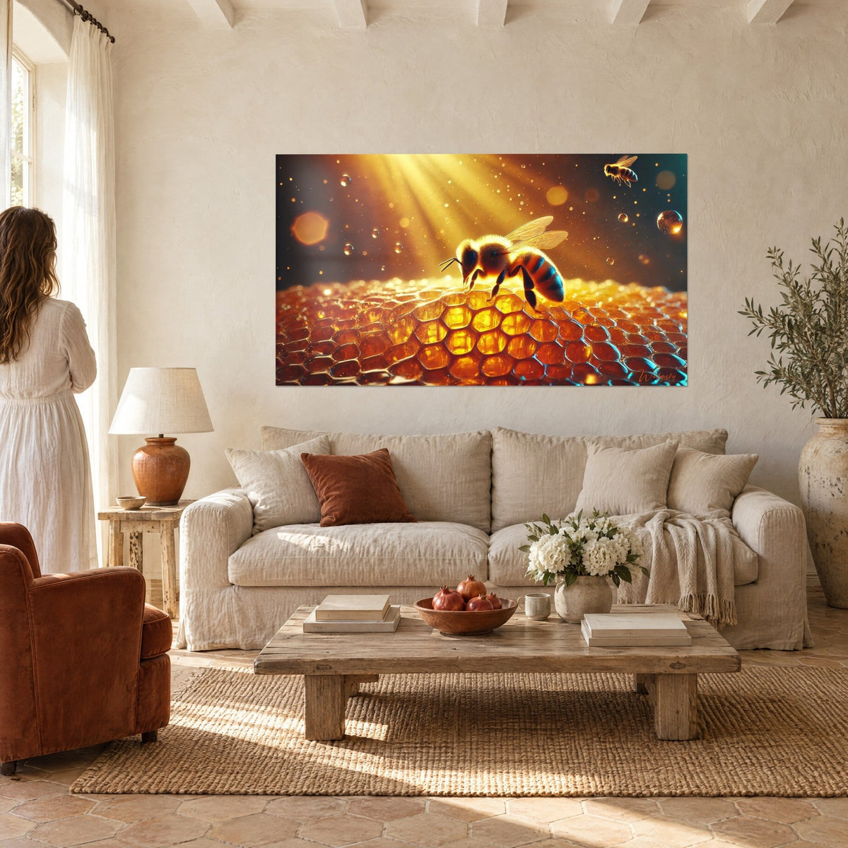 Wall art fuzzy honeybee resting on amber honeycomb cells, golden sunbeams, woman seen from behind, above a sofa in a bright living room