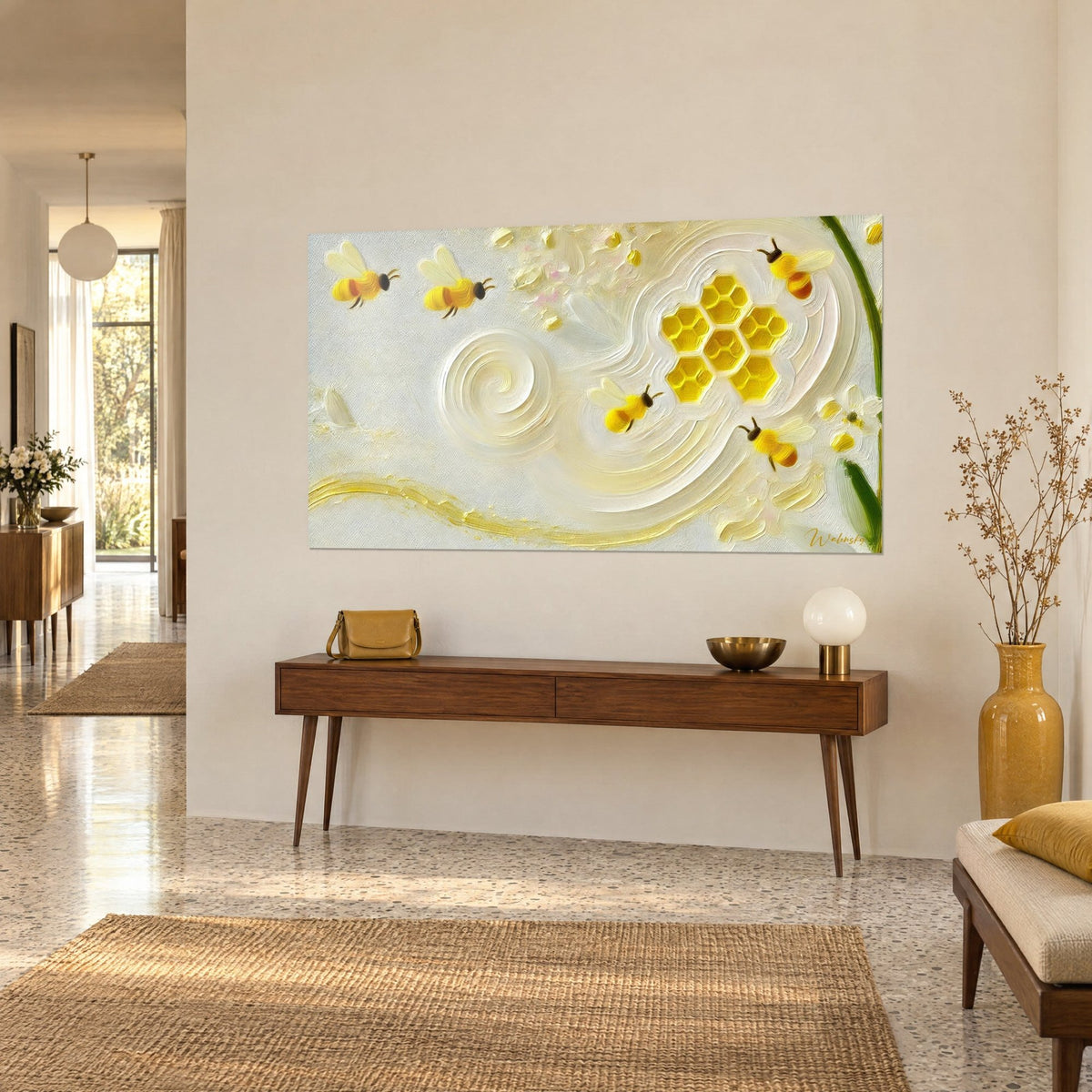 Wall art beehive of golden hexagonal cells over cream and ivory paint swirls, three-quarter view above a wooden console table