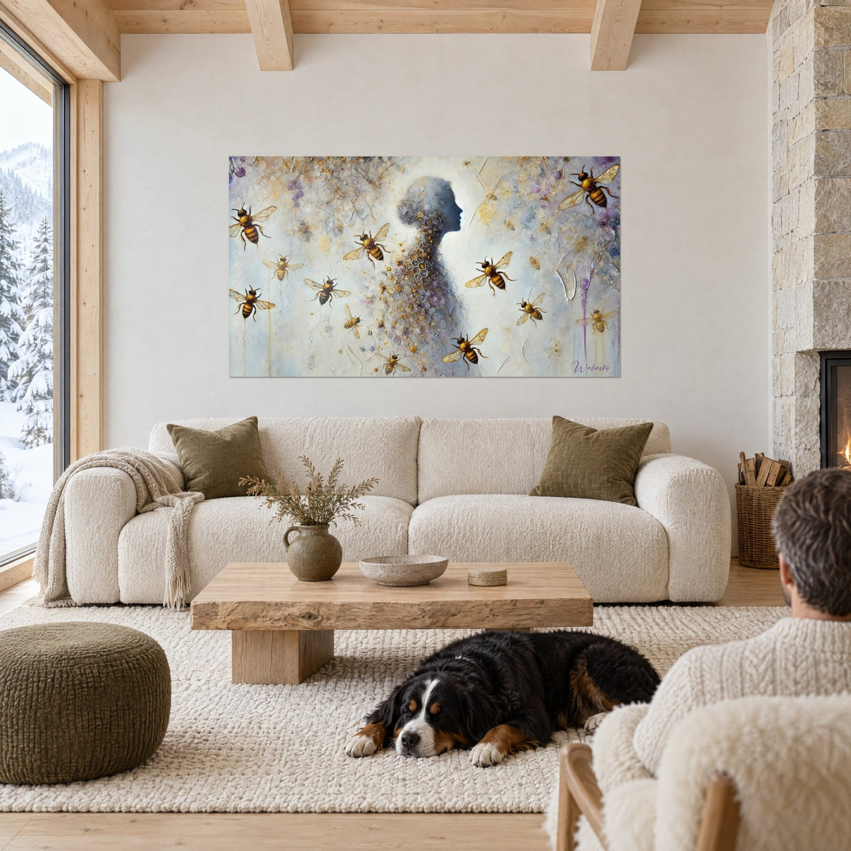 Wall art bluish silhouette in profile, golden bees in flight, white and lilac background, reclining dog, above a sofa in a bright living room