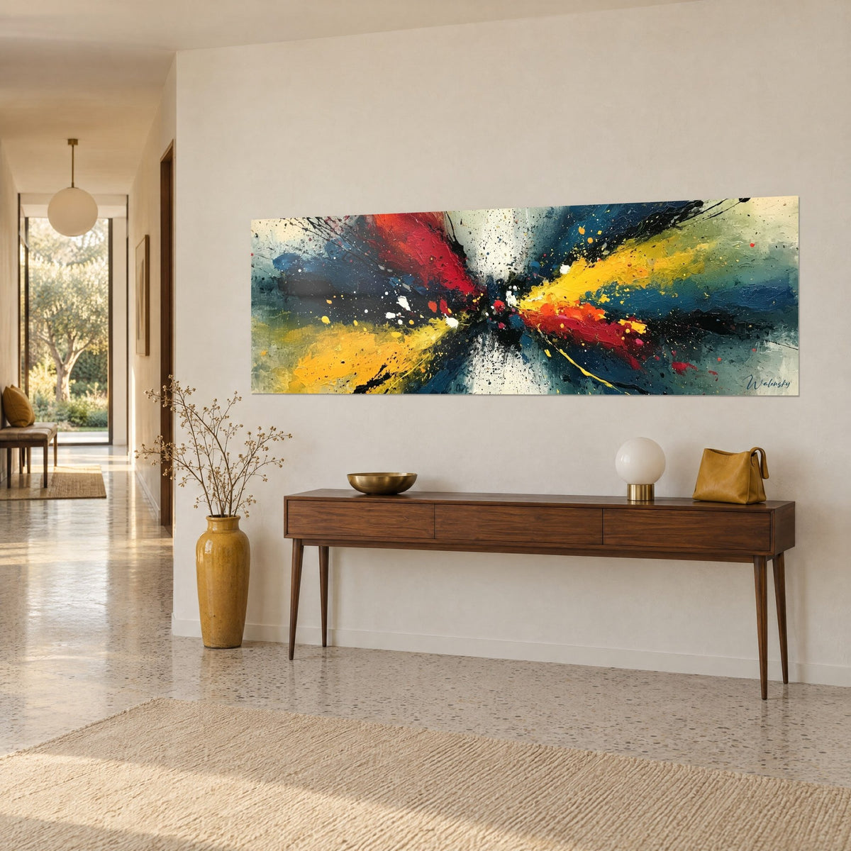 Wall art paint explosion in bright red and sunny yellow, black fan-shaped streaks, on a beige wall above a console table