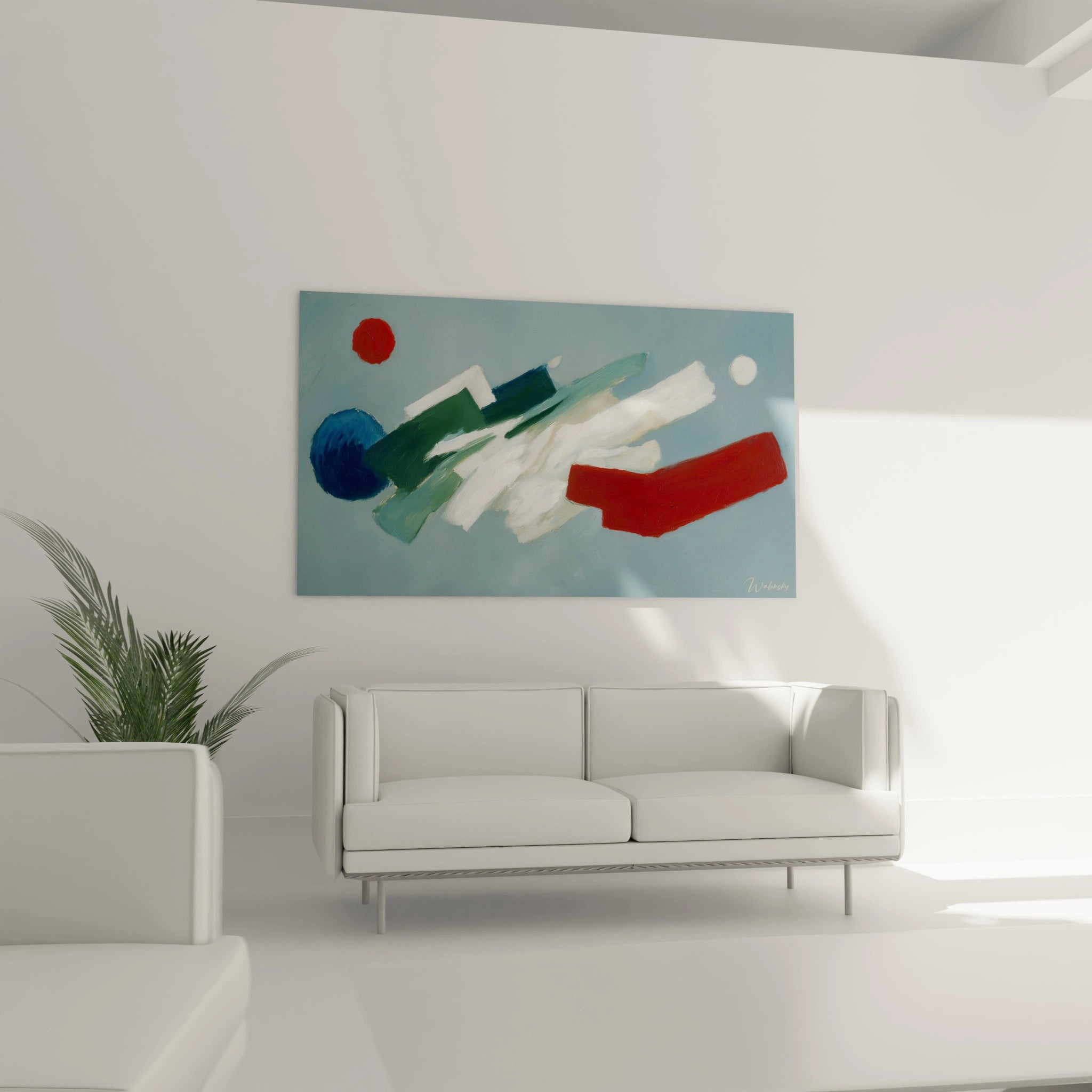 tableau abstrait géométrique Walensky bleu vert et rouge sur fond clair accroché au mur au dessus d un canapé blanc