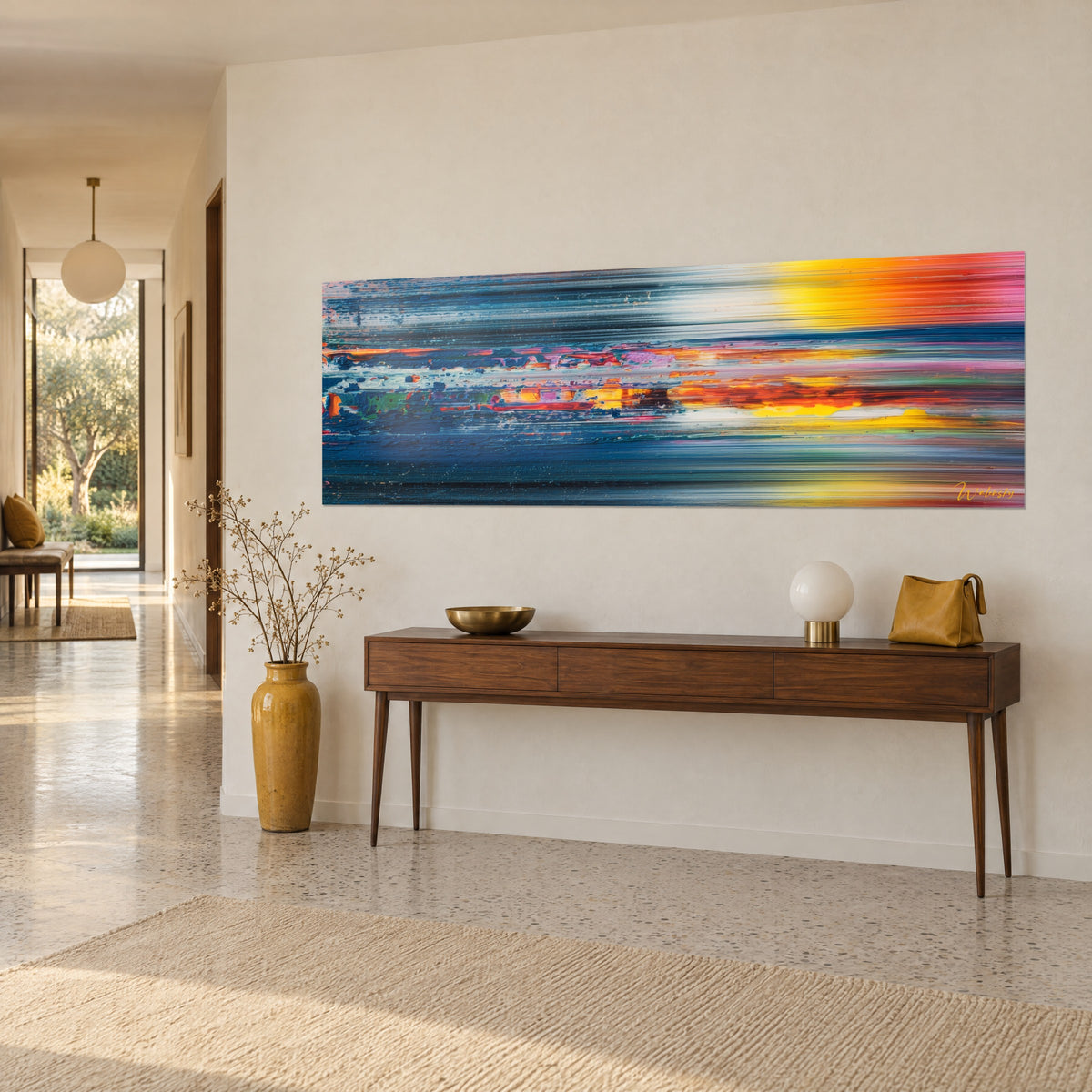 Wall art vibrant scraped horizon, night-blue bands and pink-orange flashes on a beige wall, seen three-quarters, above a wooden console