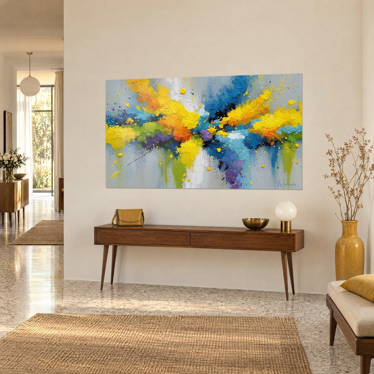 Wall art with an explosion of thick saffron, azure and violet paint, green drips, on a beige wall above a wooden console