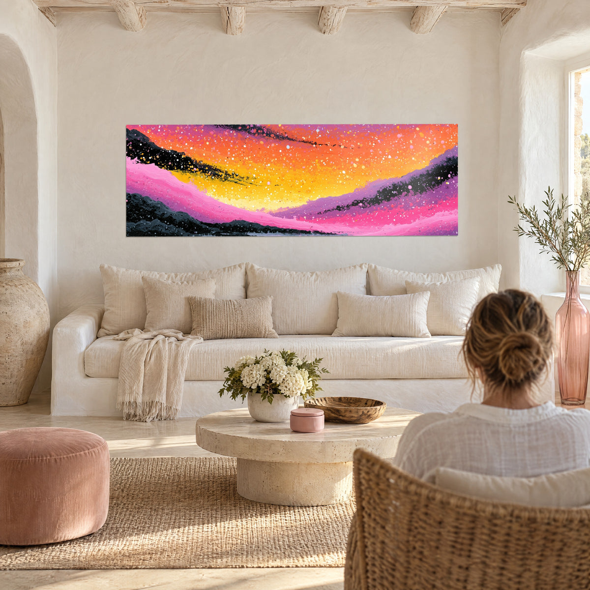 Wall art pink and orange galactic waves, white stardust on black streaks, above a sofa in a bright living room