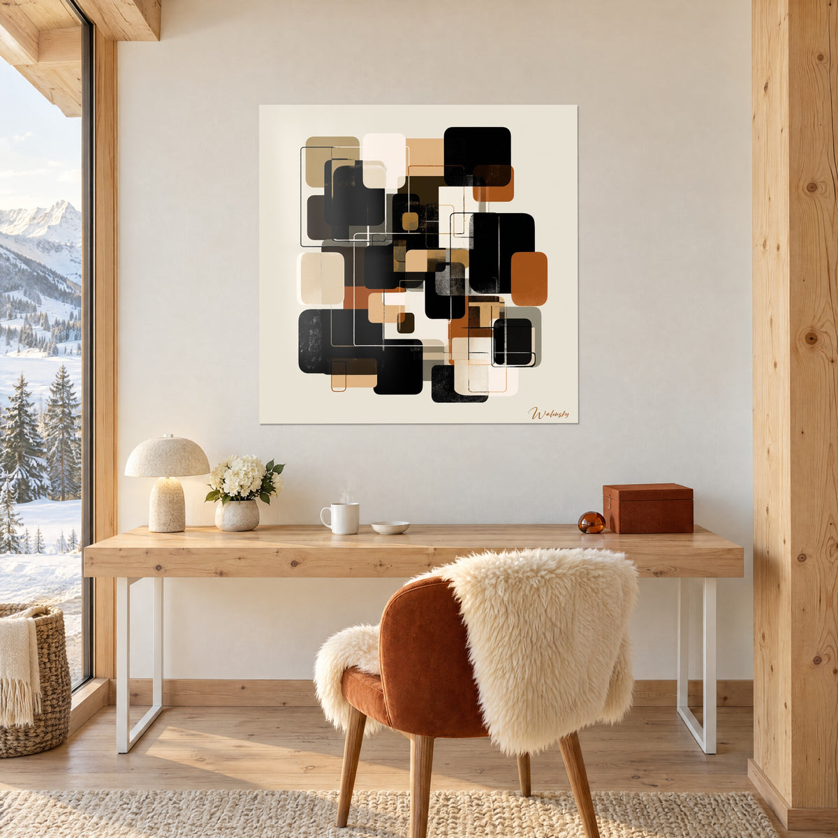 Tableau abstraction de carrés superposés noir, rouille et beige, accroché au-dessus d'un bureau en bois clair