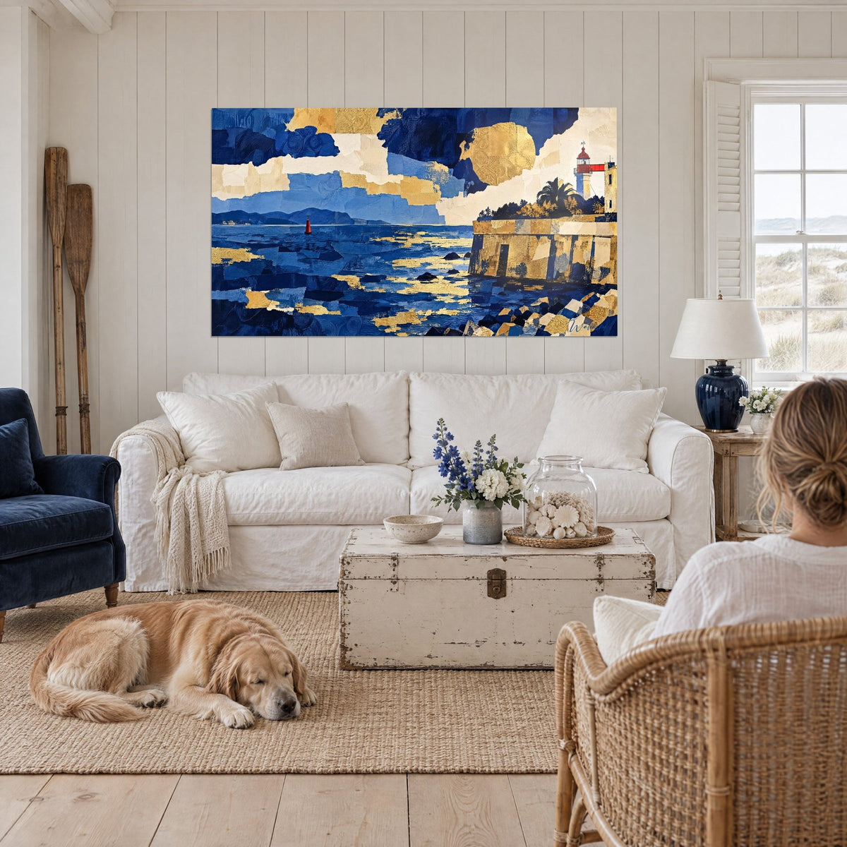 Wall art red and white lighthouse above a golden citadel, midnight blue sea, reclining retriever, above a sofa in a bright living room