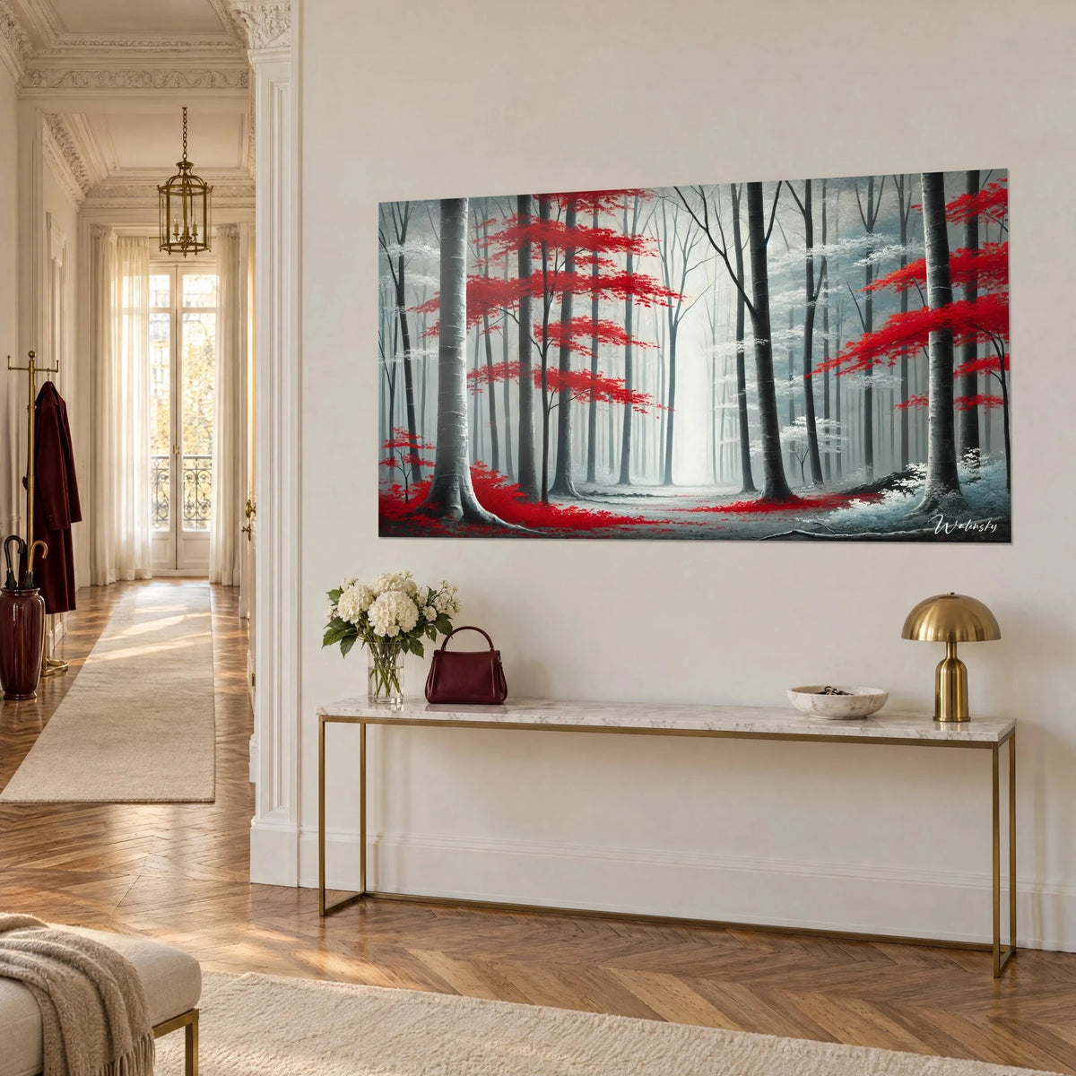 Wall art beech forest with scarlet frosted leaves and white mist in the background, hung above a gold console table