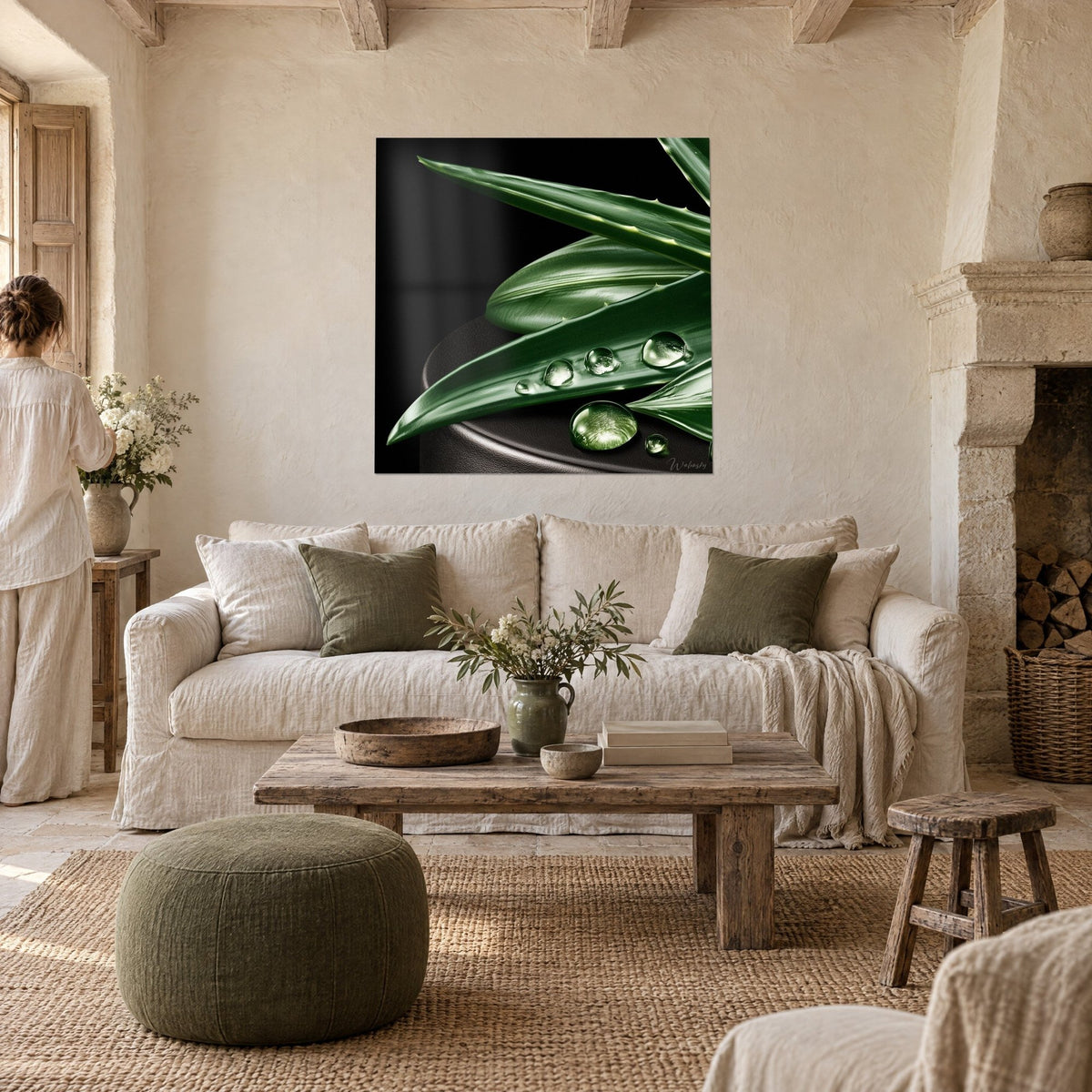 Wall art forest green aloe leaves on a black background, crystal clear water droplets, above a sofa in a bright living room