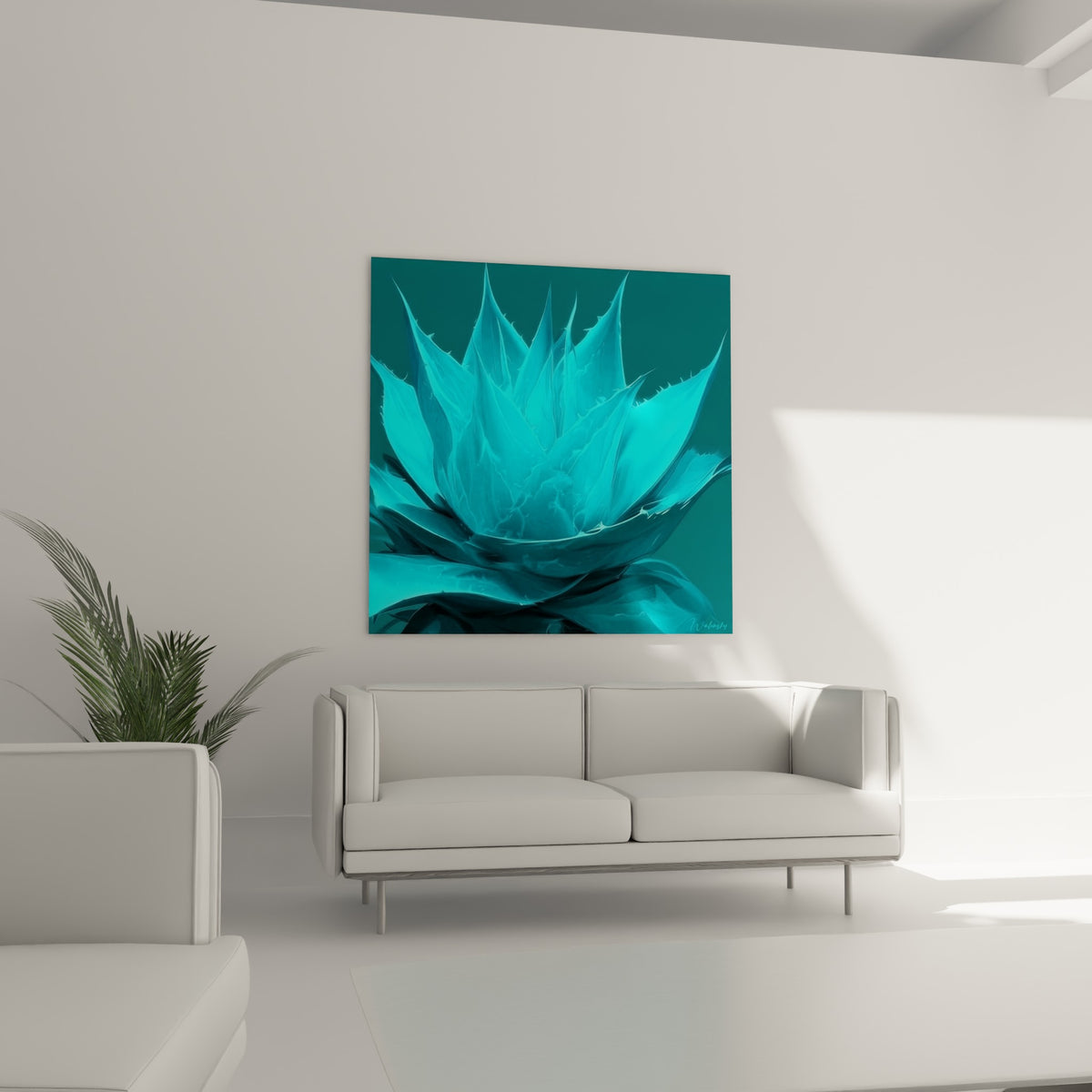 Feuilles d'aloe vera turquoise et anthracite disposées au-dessus d'un canapé dans un salon lumineux