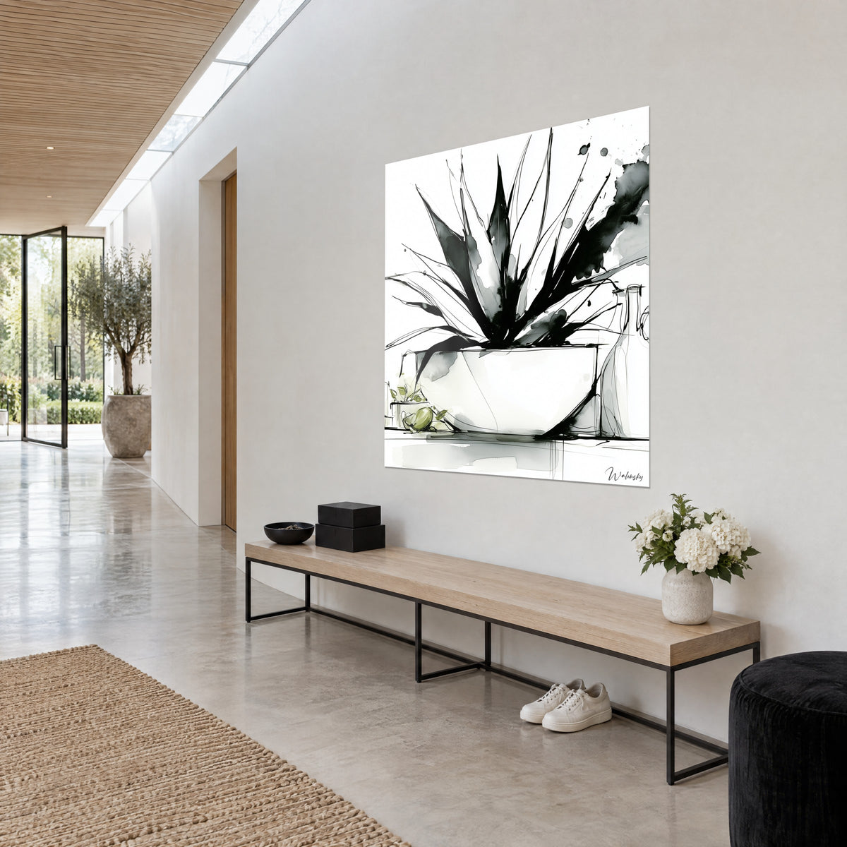 Wall art of aloe vera in Indian ink, pointed black and grey leaves, olive green on the floor, on the white wall of a spacious hallway