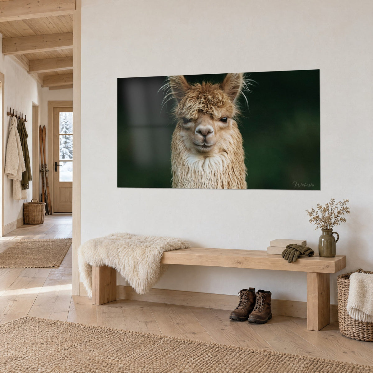 Wall art camelid with tousled fringe, pink muzzle and knowing gaze on dark green background, light wood bench of a chalet