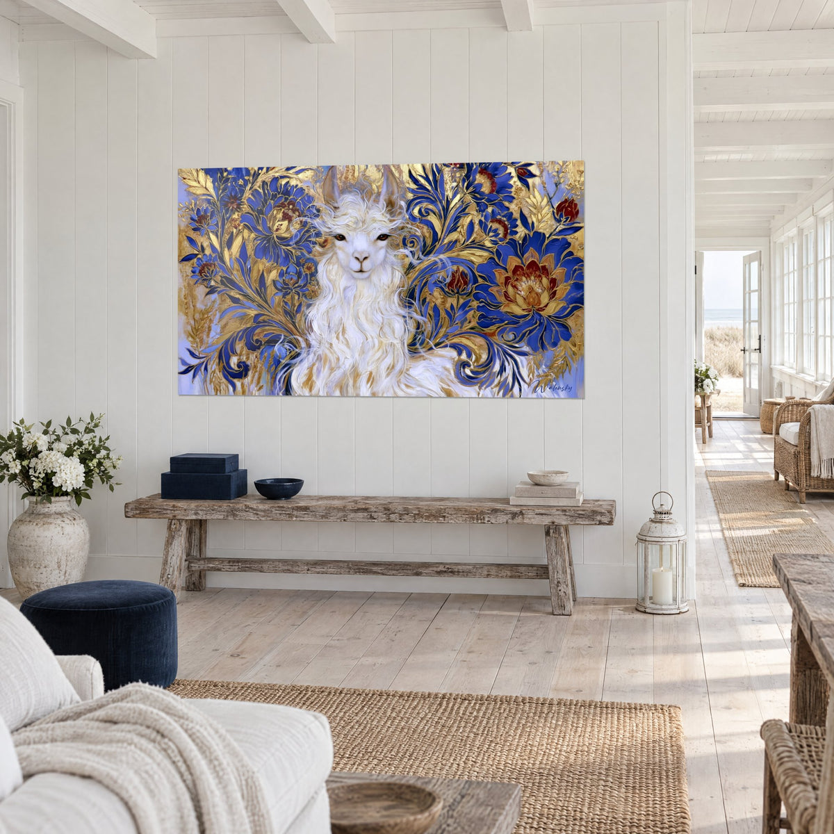 Wall art of a woolly camelid with amber eyes surrounded by cobalt flowers and golden foliage, raw wood bench in a bright hallway