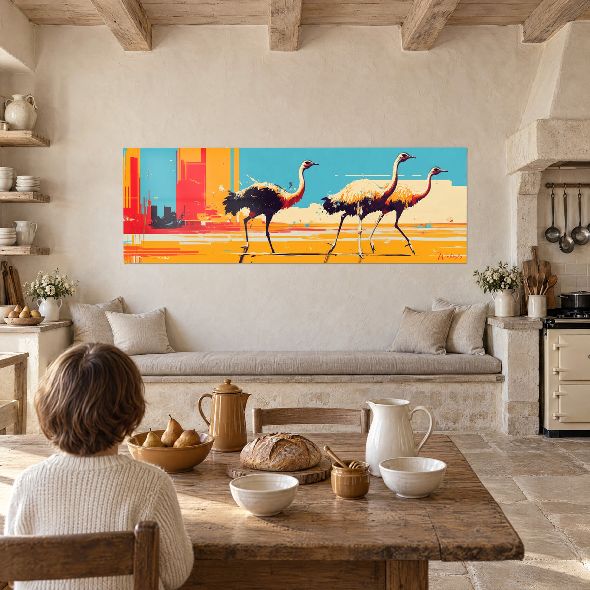 Wall art giant birds in a row, dark and cream feathers, turquoise sky, orange ground, above a wooden kitchen table