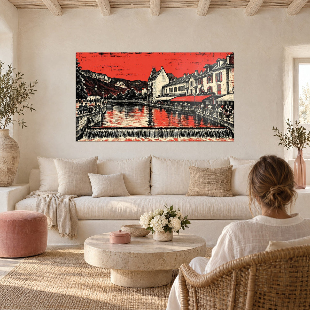 Wall art red and black canal under a blazing sky, quayside lined with cream facades and a carmine awning, above a sofa in a bright living room