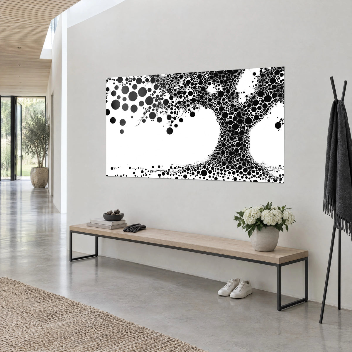 Wall art massive trunk made of tightly packed black bubbles on pure white, seen three-quarter, white flowers and a light wooden bench beneath the frame