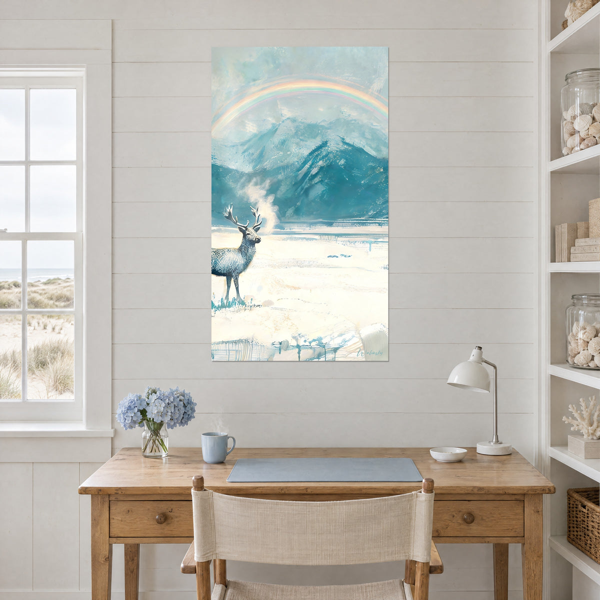 Wall art teal blue icy mountain landscape, white stag exhaling its vapour, pastel arc, on an office wall near a window