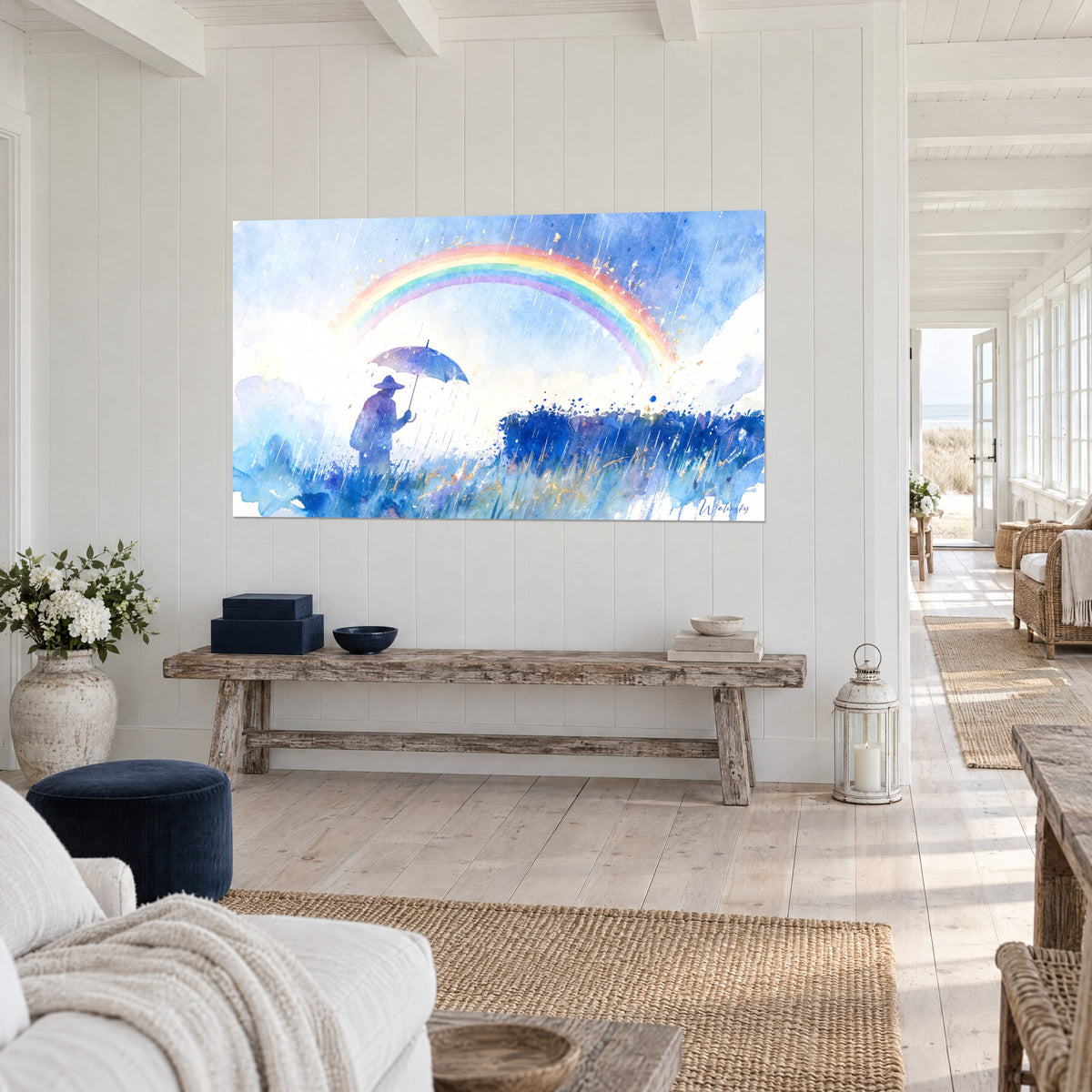 Tableau promeneur à chapeau sous la pluie, arc-en-ciel rose et vert, éclats dorés, au mur d'une maison de bord de mer