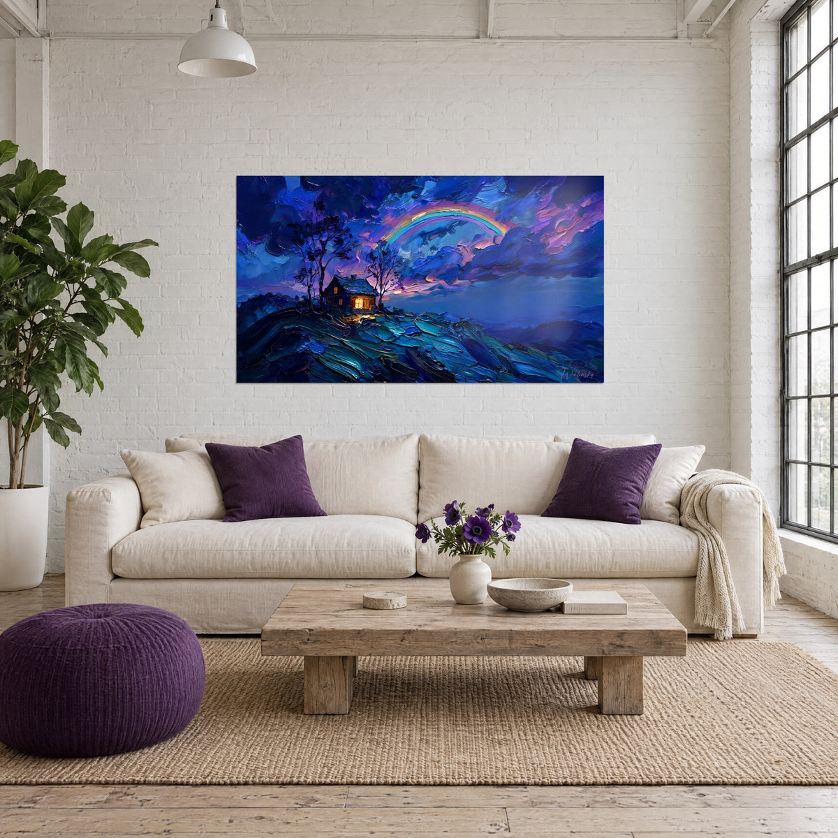Wall art cottage with golden windows under a rainbow, midnight blue and violet clouds, above a sofa in a bright living room