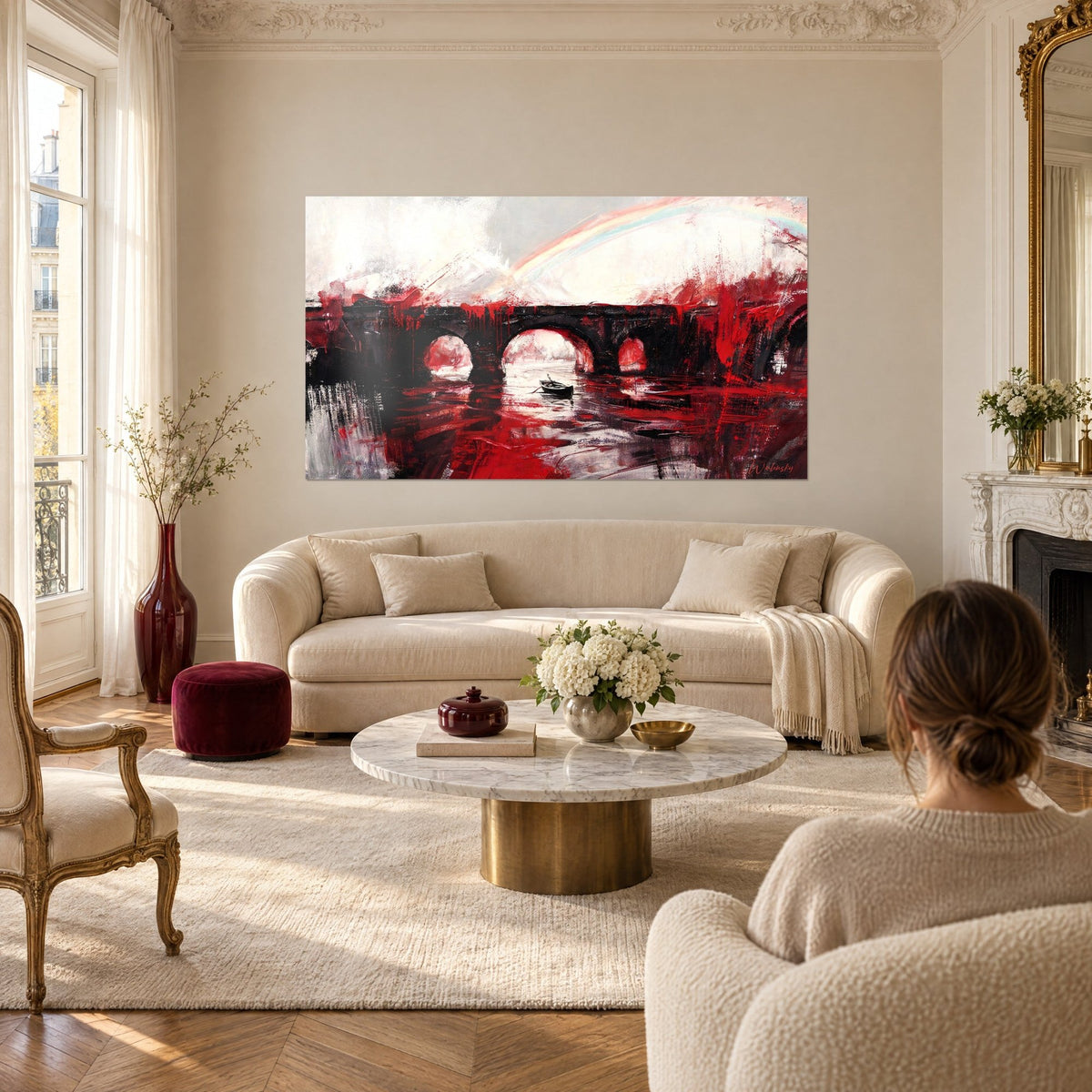 Tableau aqueduc de pierre noire aux coulures rouge sang, arc-en-ciel pâle, barque sombre, au-dessus d'un canapé dans un salon lumineux