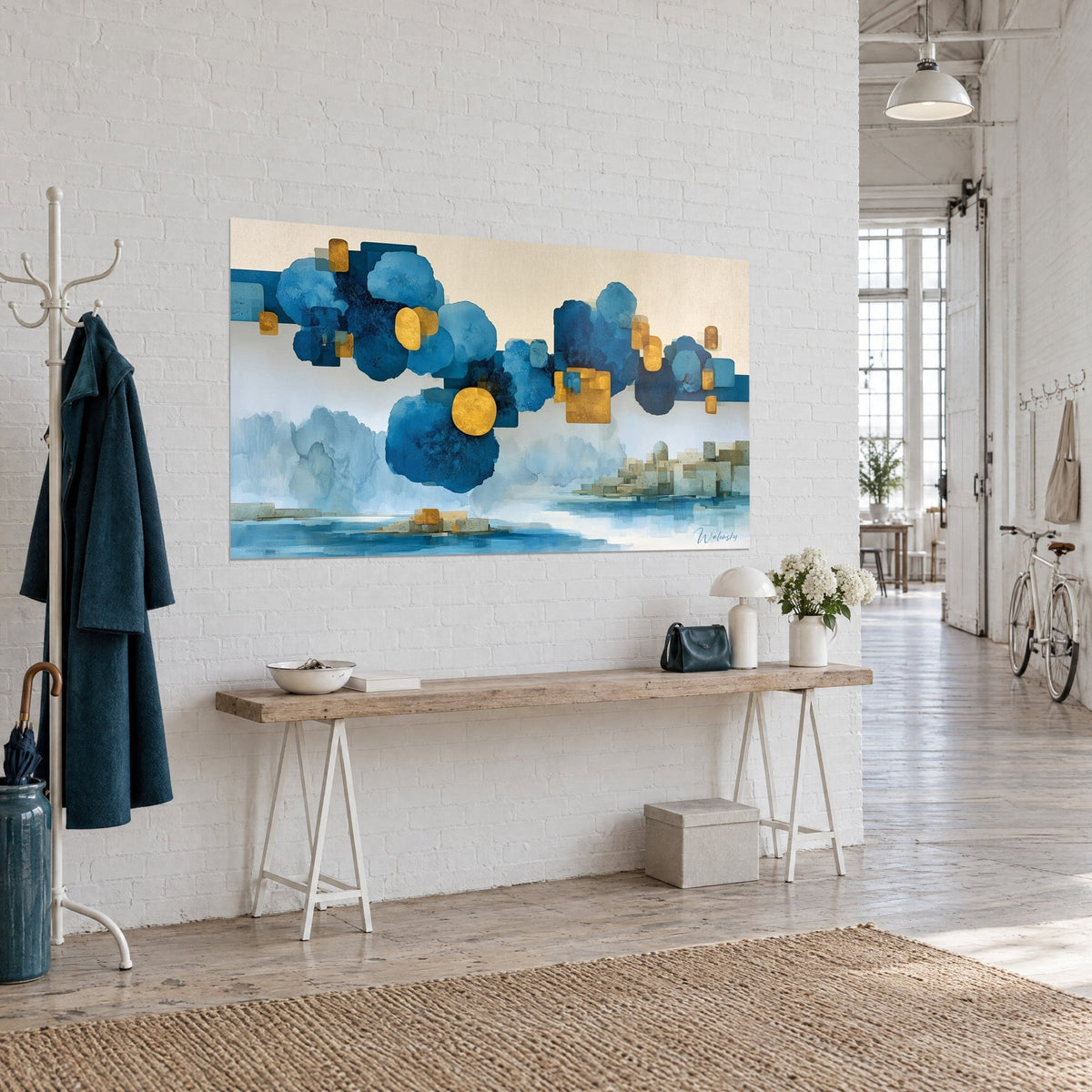 Wall art suspended dreamlike piece with ultramarine watercolor washes and gold dots, three-quarter view, wooden console in the loft