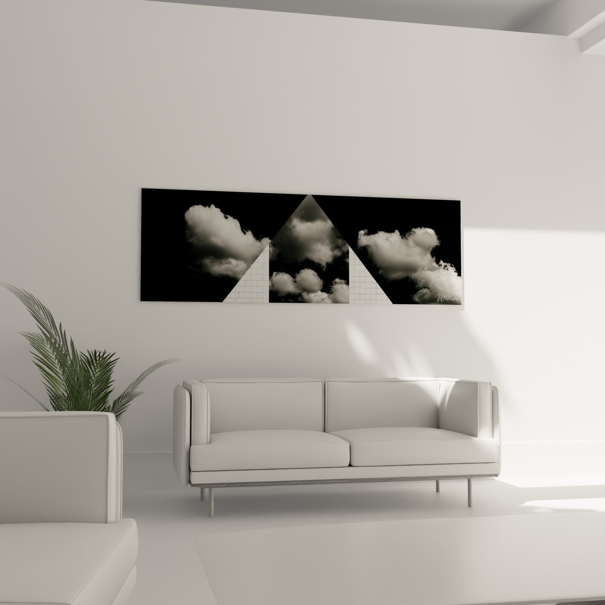 Contraste noir et blanc de ce tableau architecture abstrait au-dessus d'un canapé dans un salon lumineux