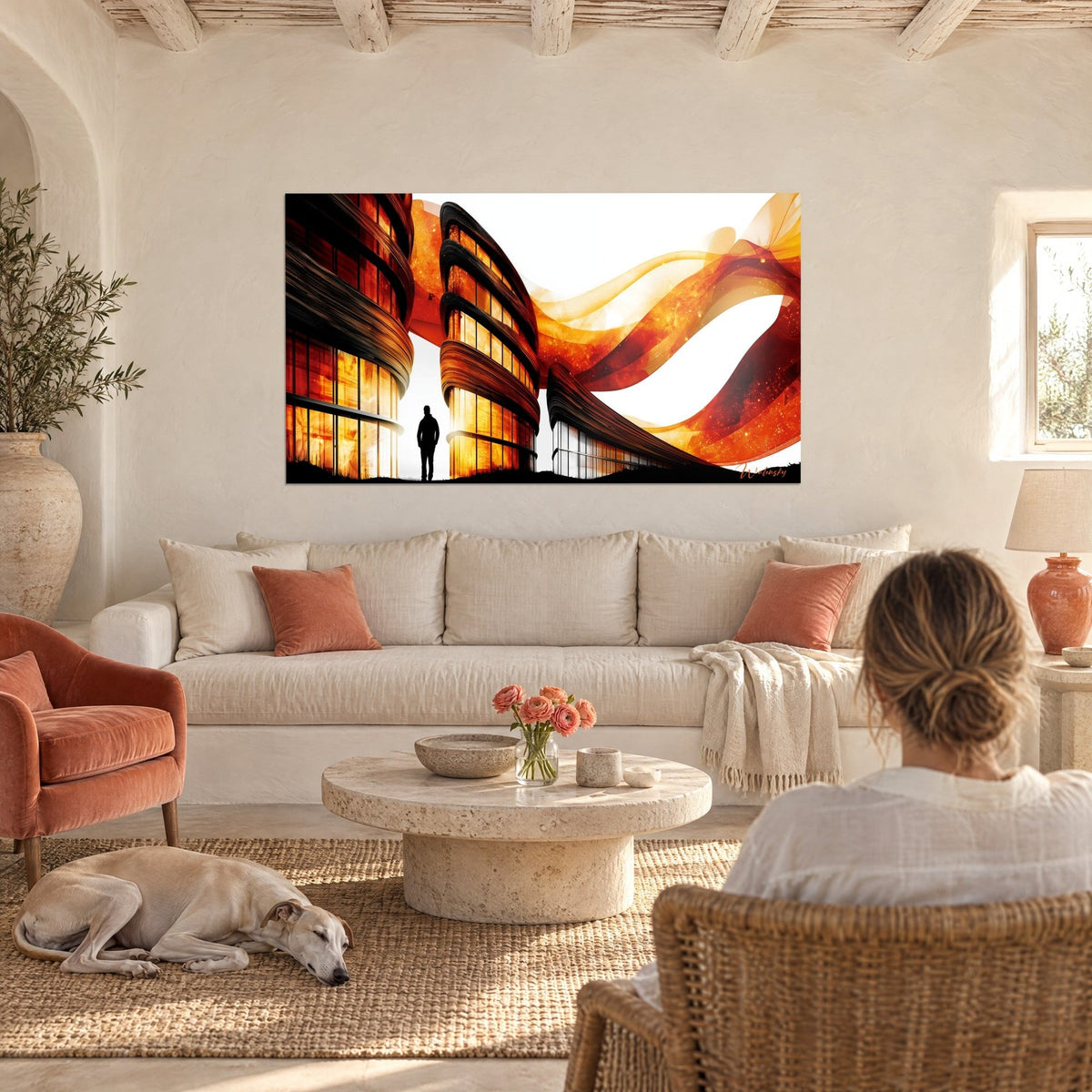 Tableau silhouette d'homme devant un immeuble courbe orange et noir, rubans ambre flottants, au-dessus d'un canapé dans un salon lumineux